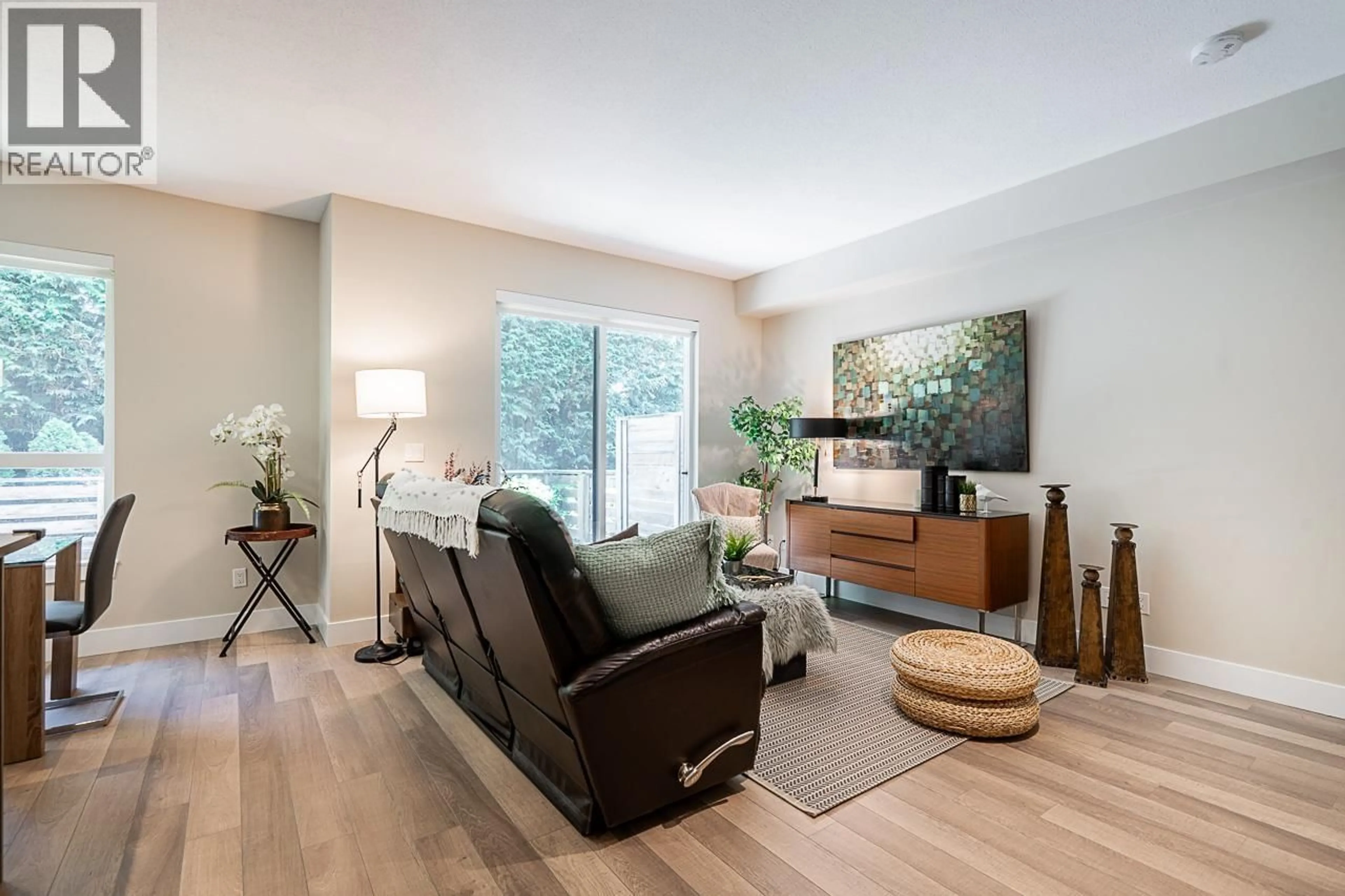 Living room with furniture, wood/laminate floor for 20 - 8288 NO.1 ROAD, Richmond British Columbia V7C1T9