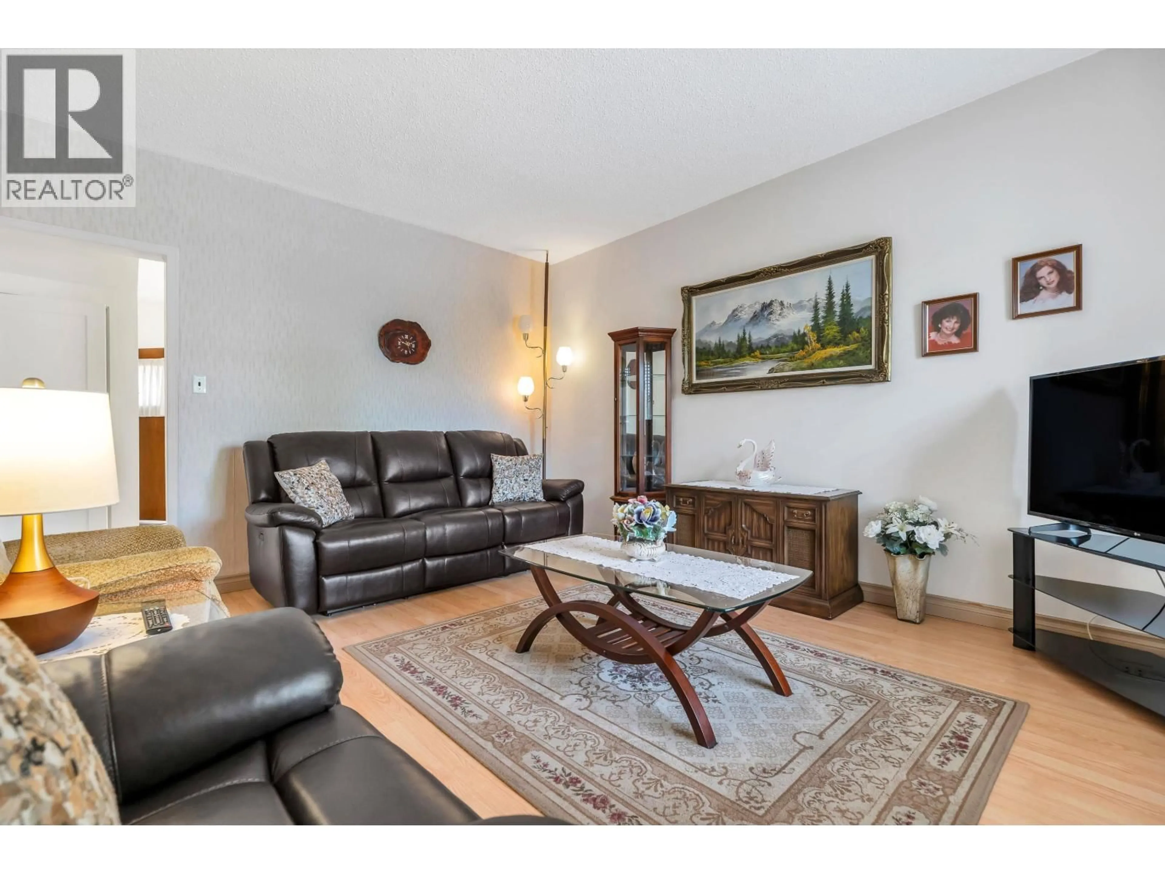 Living room with furniture, wood/laminate floor for 2560 ADANAC STREET, Vancouver British Columbia V5K2M5