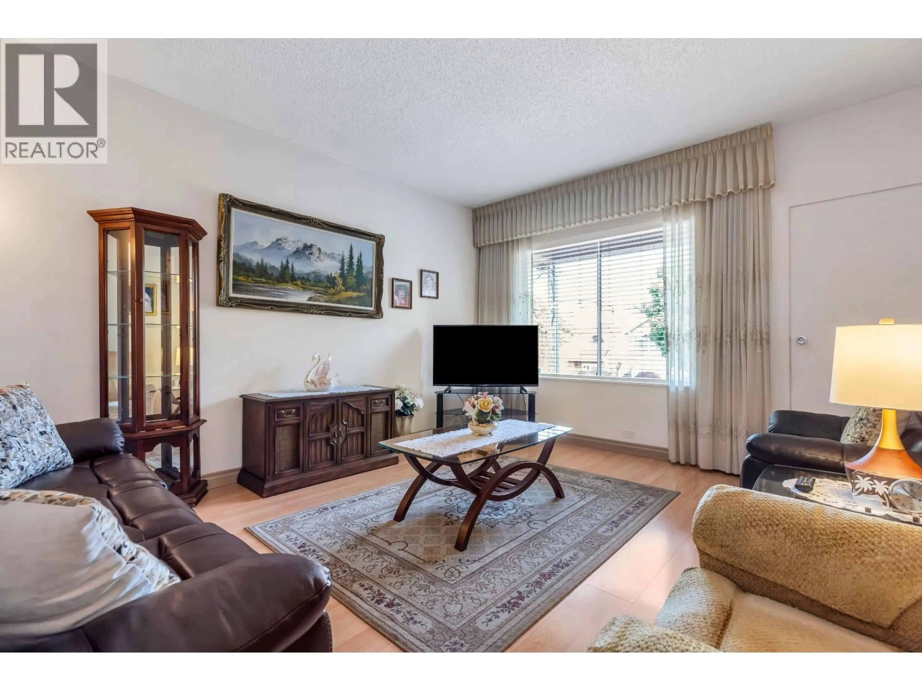 Living room with furniture, wood/laminate floor for 2560 ADANAC STREET, Vancouver British Columbia V5K2M5
