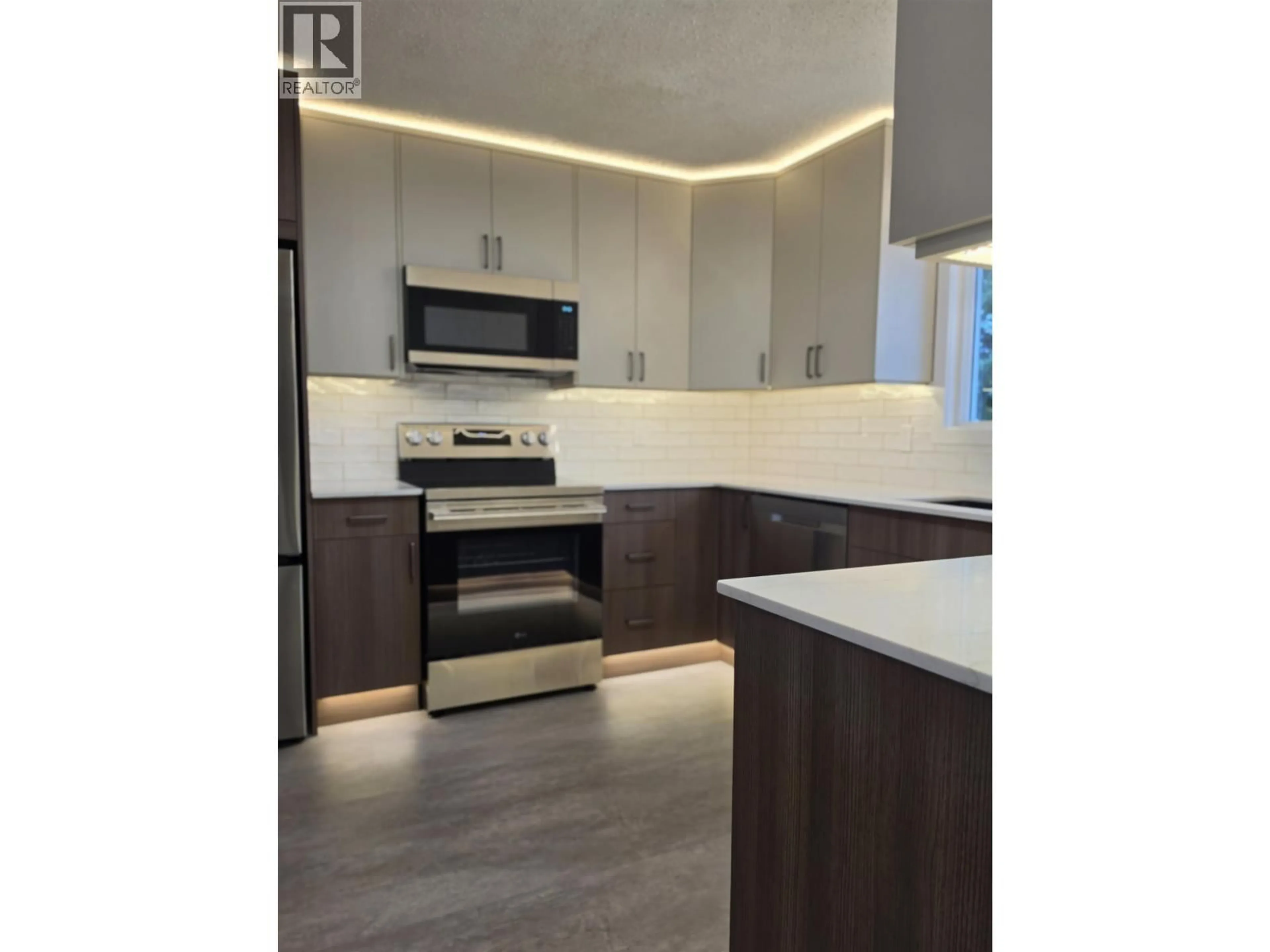 Open concept kitchen, wood/laminate floor for 6900 ALDEEN ROAD, Prince George British Columbia V2N5P8