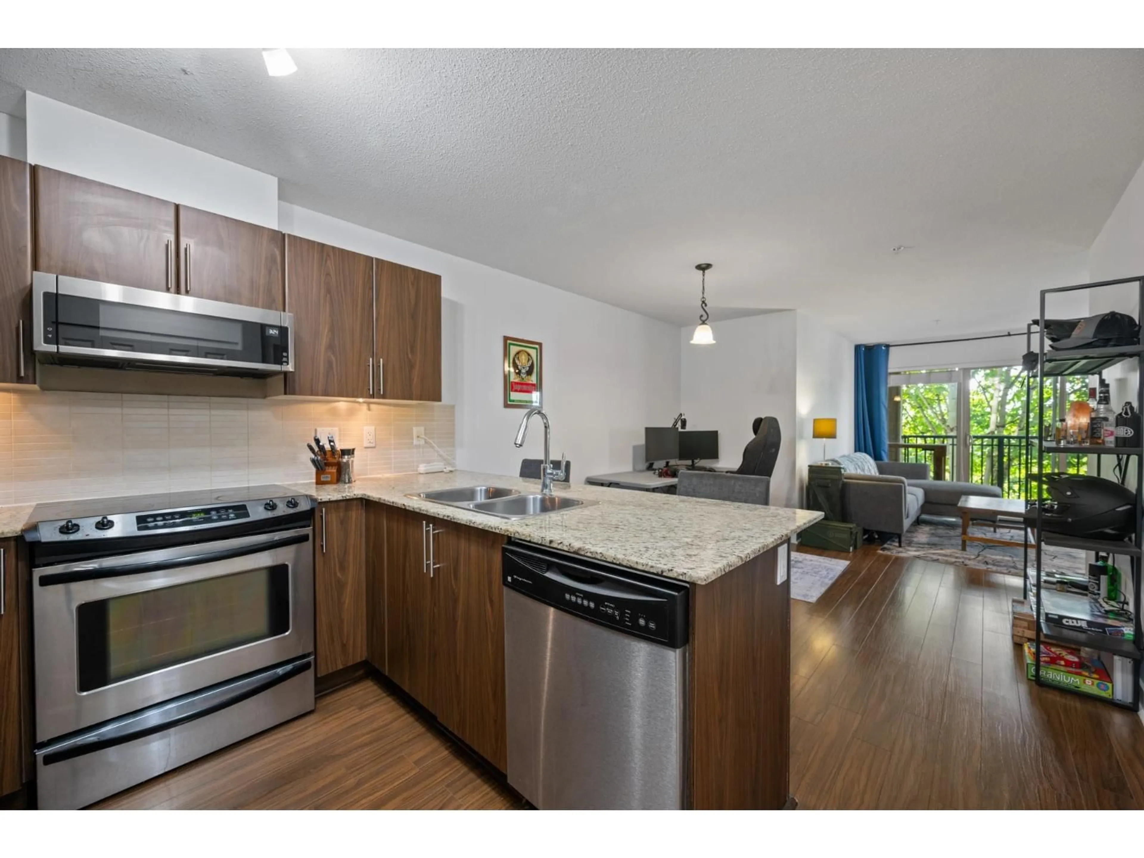 Open concept kitchen, wood/laminate floor for C207 - 8929 202 STREET, Langley British Columbia V1M0B4