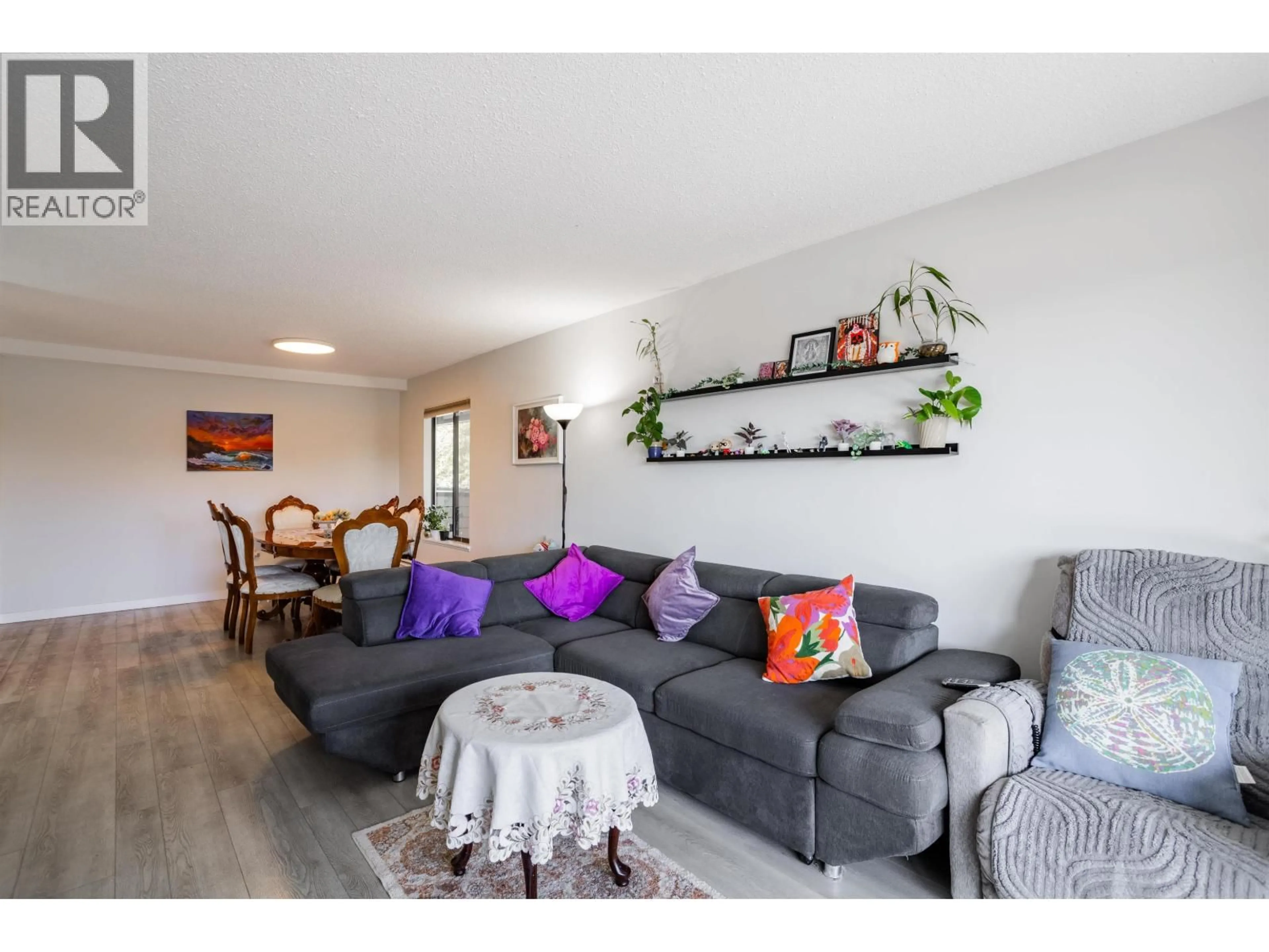 Living room with furniture, wood/laminate floor for 108 - 8860 NO. 1 ROAD, Richmond British Columbia V7C4C2