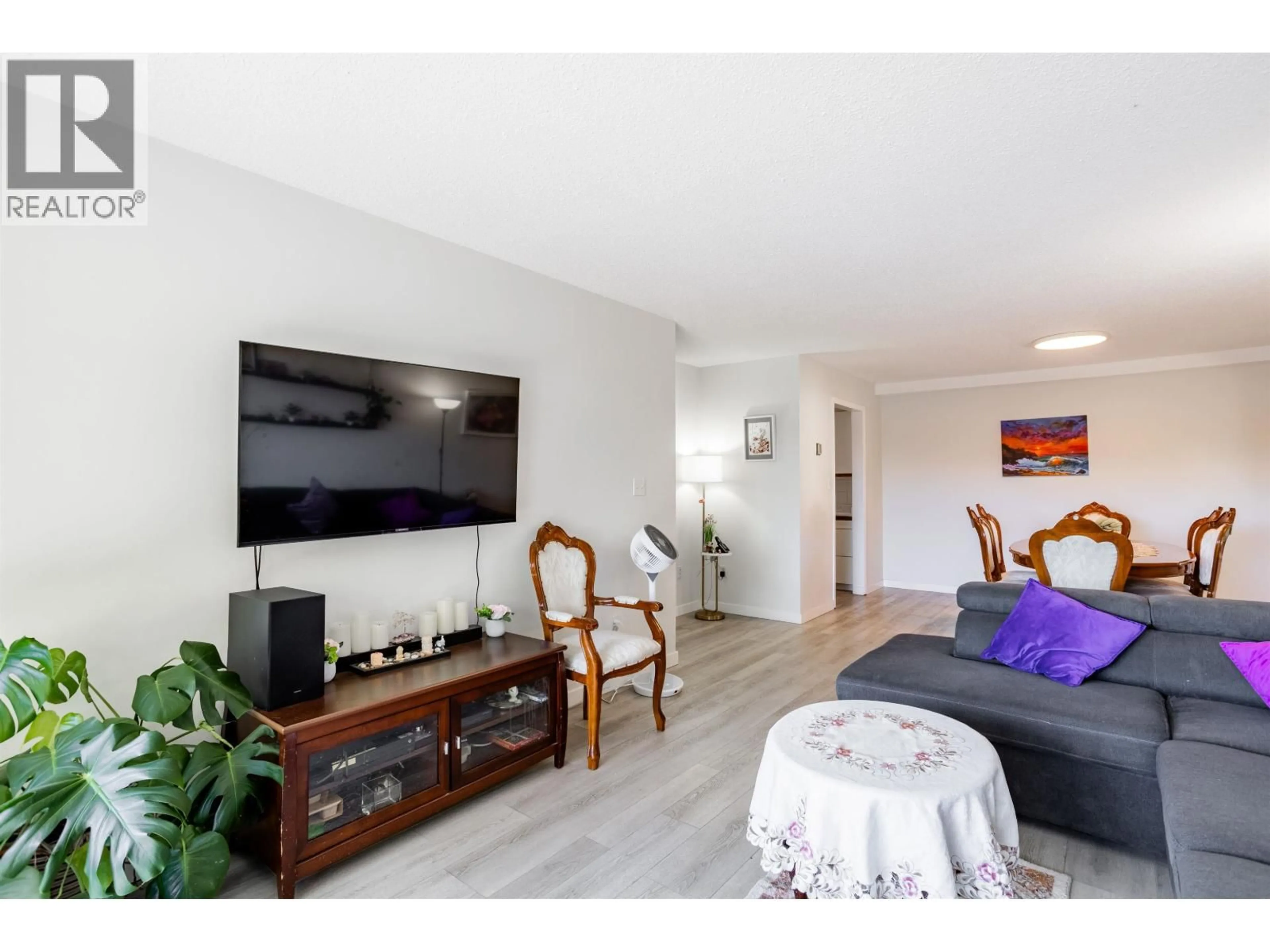Living room with furniture, wood/laminate floor for 108 - 8860 NO. 1 ROAD, Richmond British Columbia V7C4C2
