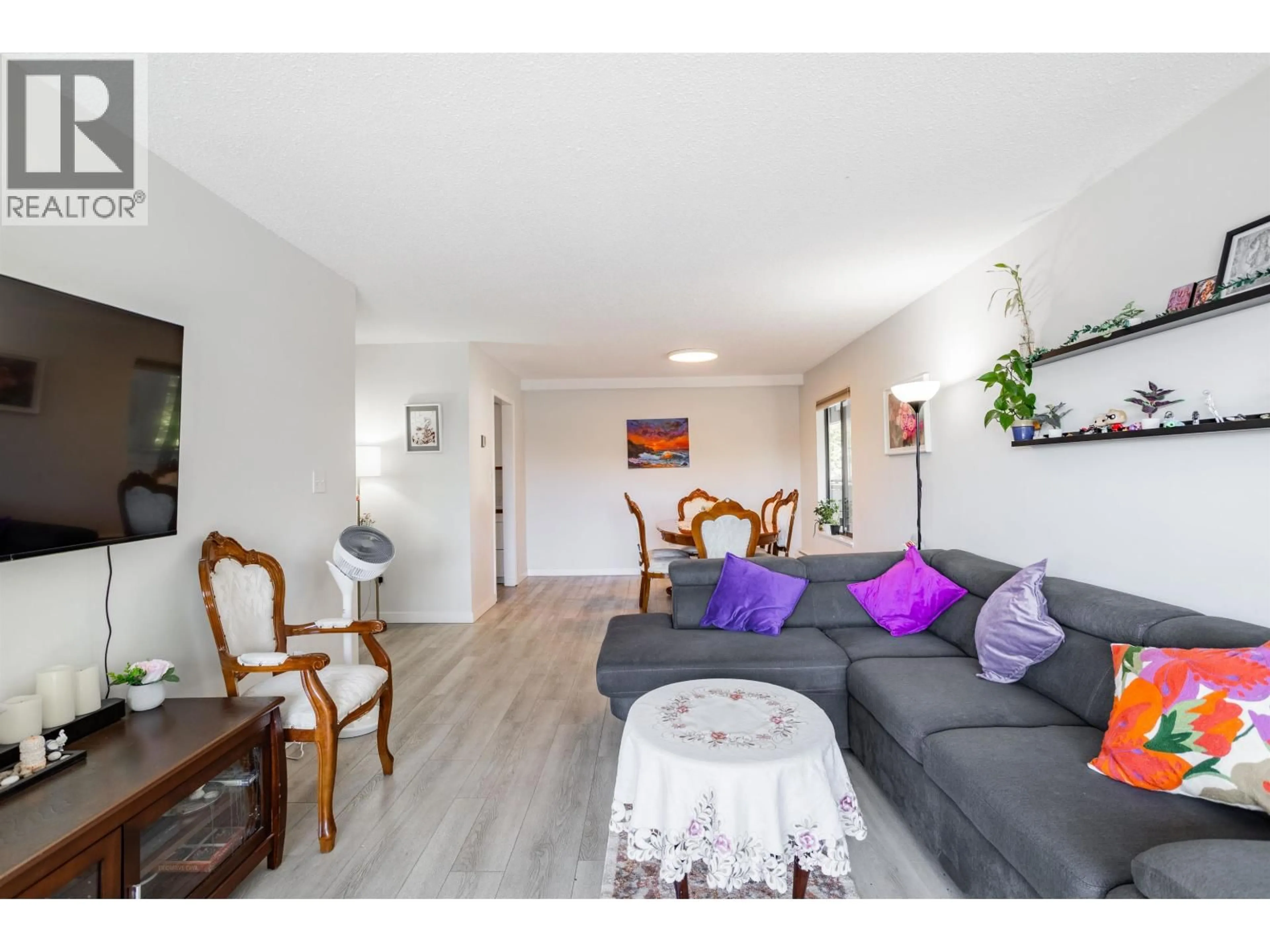 Living room with furniture, wood/laminate floor for 108 - 8860 NO. 1 ROAD, Richmond British Columbia V7C4C2