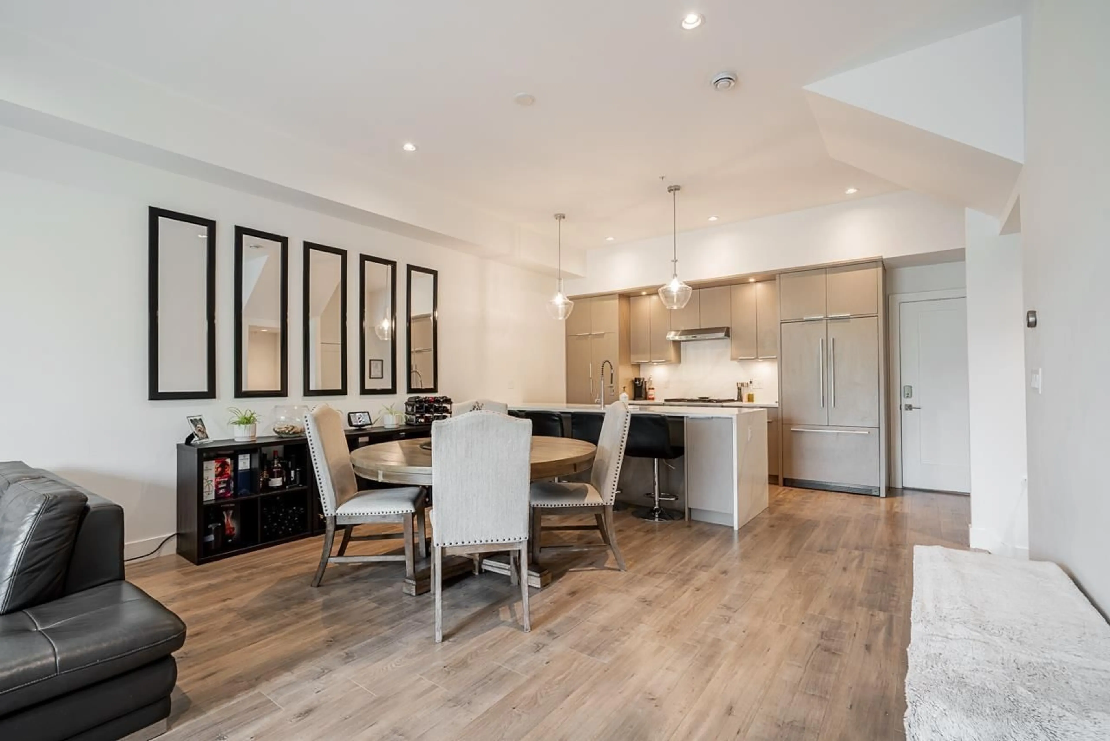 Open concept kitchen, wood/laminate floor for 8142 202 STREET, Langley British Columbia V2Y3K2