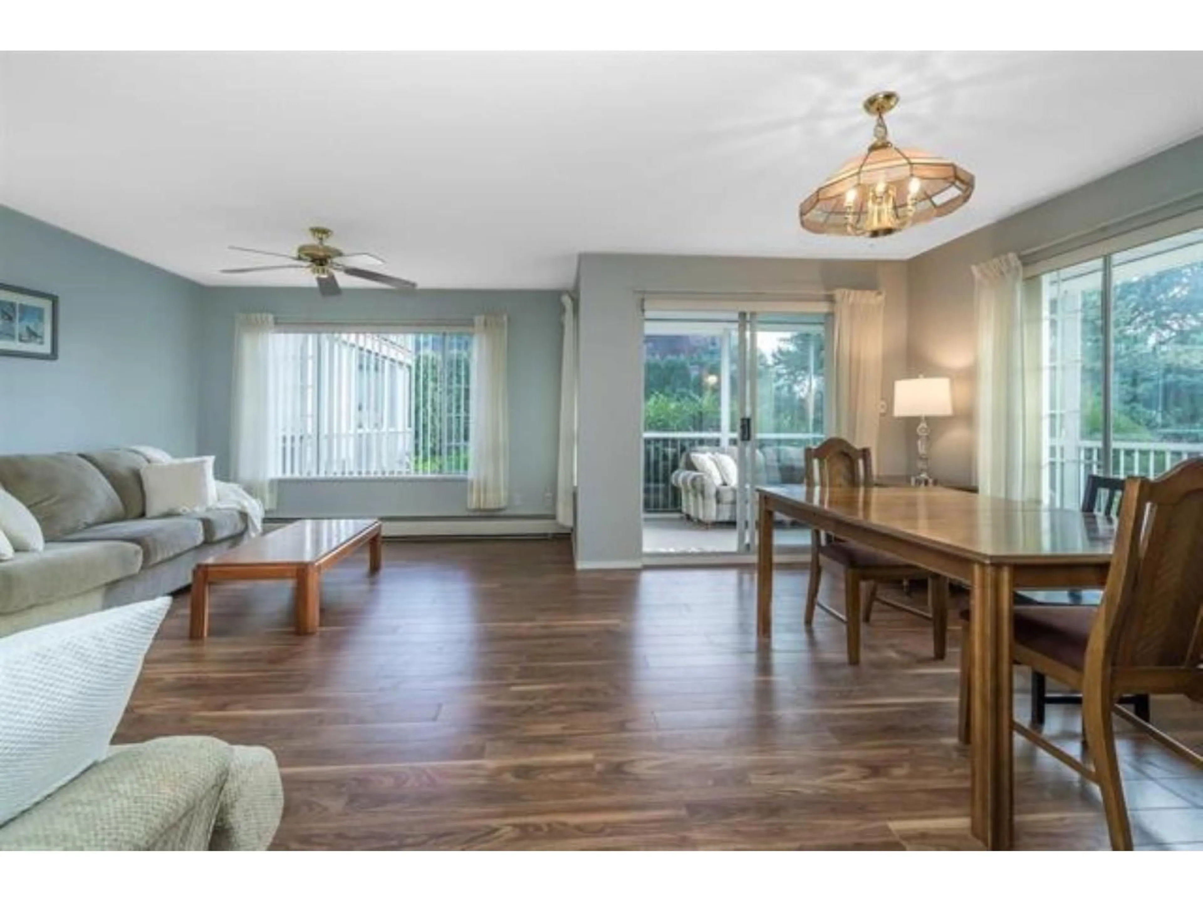 Living room with furniture, wood/laminate floor for 102 - 32145 OLD YALE ROAD, Abbotsford British Columbia V2T2C8