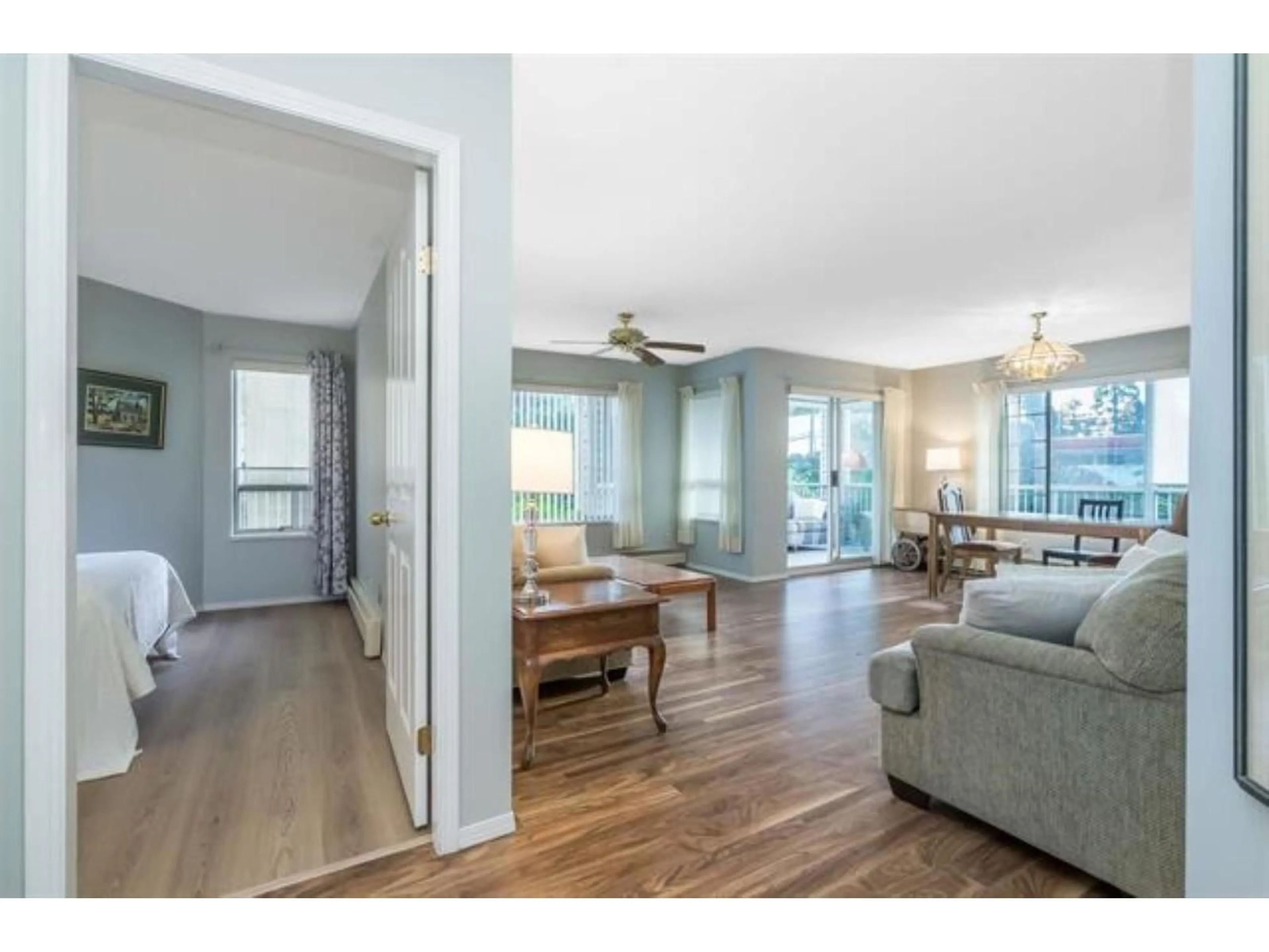 Living room with furniture, wood/laminate floor for 102 - 32145 OLD YALE ROAD, Abbotsford British Columbia V2T2C8