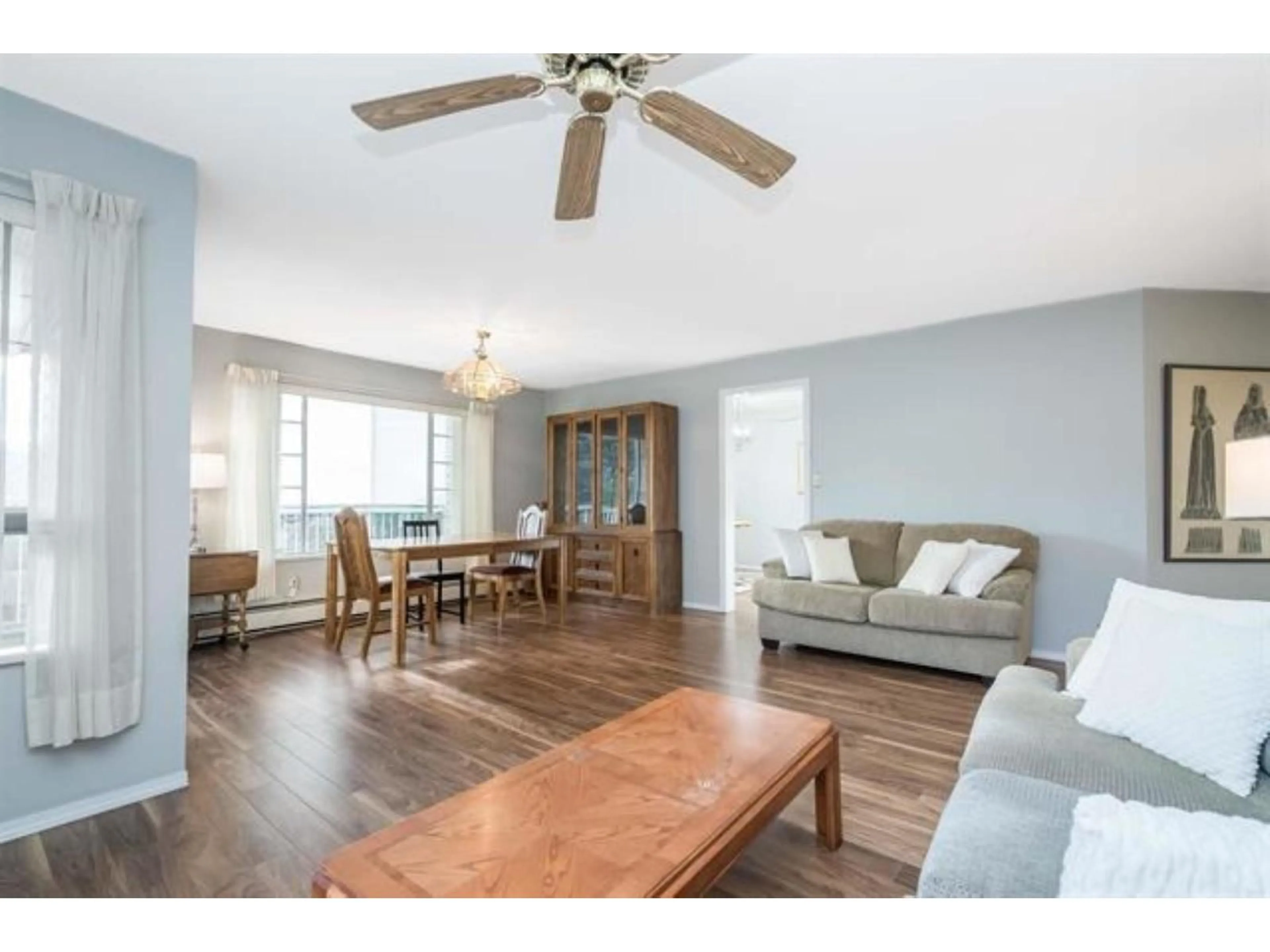 Living room with furniture, wood/laminate floor for 102 - 32145 OLD YALE ROAD, Abbotsford British Columbia V2T2C8