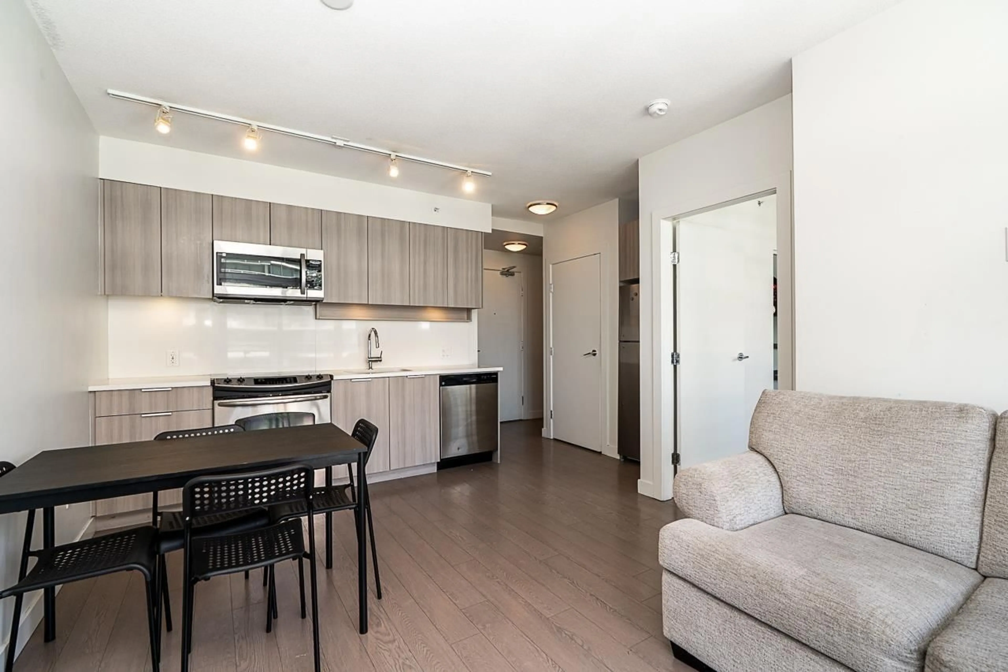 Open concept kitchen, wood/laminate floor for 2302 - 13308 CENTRAL AVENUE, Surrey British Columbia V3T0M4