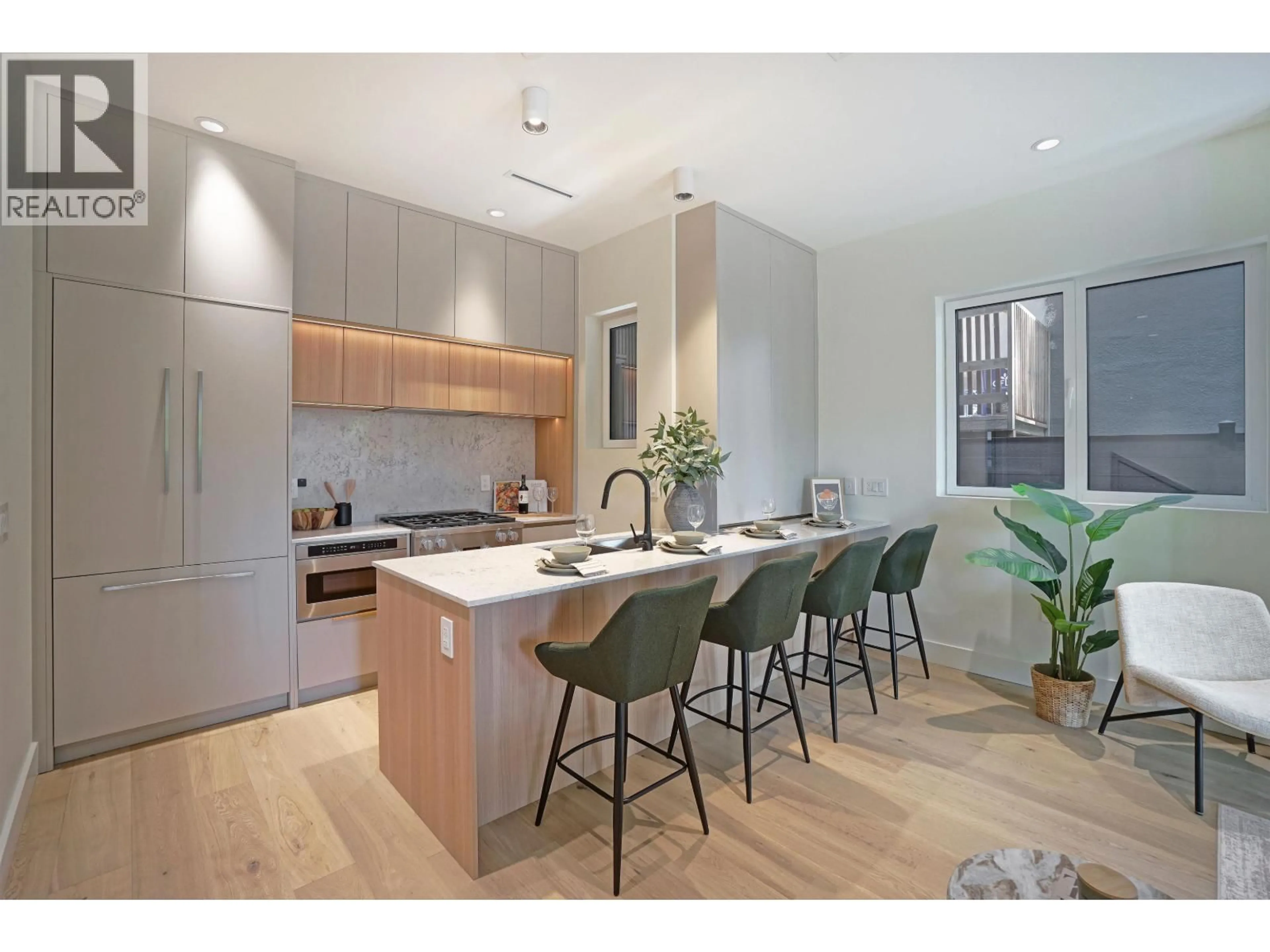 Open concept kitchen, wood/laminate floor for 1 - 3315 10TH STREET, Vancouver British Columbia V6R2E5