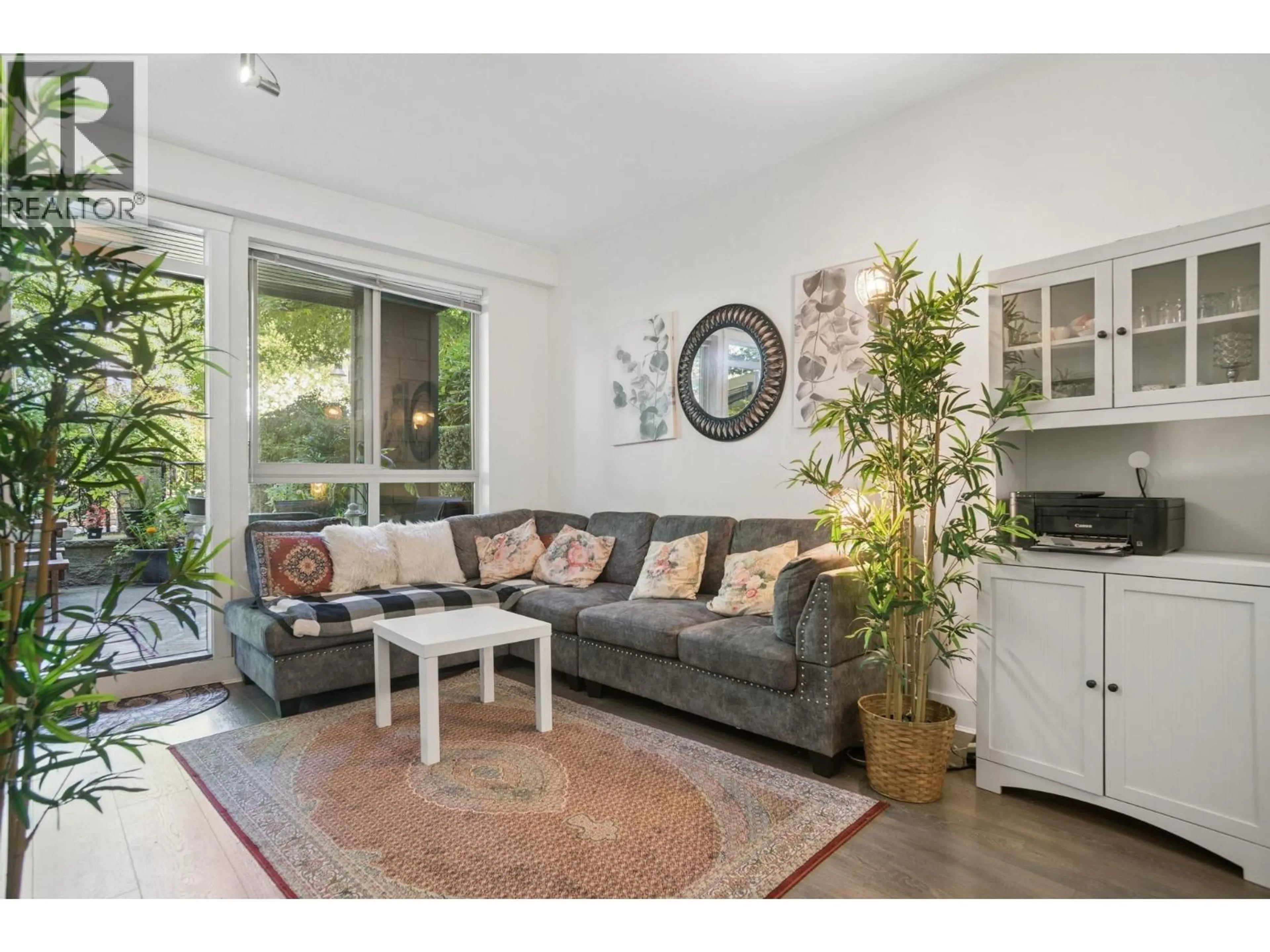 Living room with furniture, wood/laminate floor for 107 - 7478 BYRNEPARK WALK, Burnaby British Columbia V3N0B5