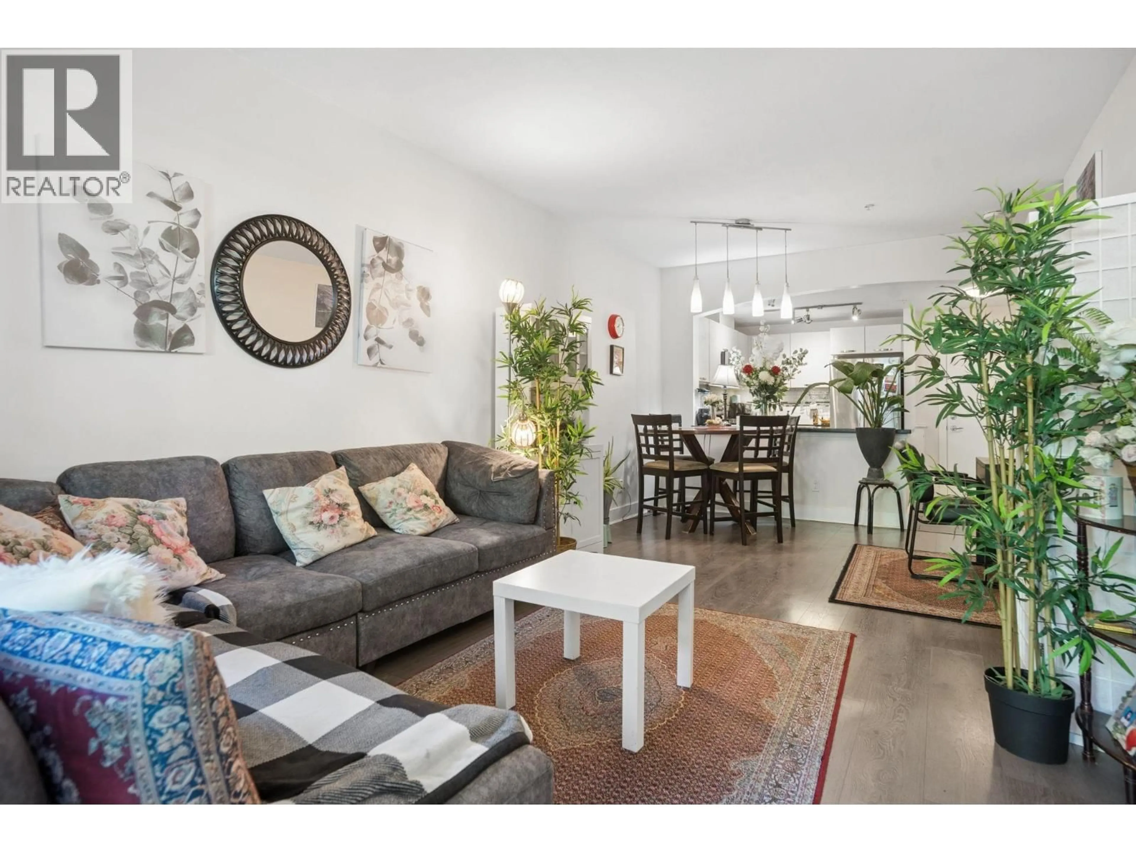 Living room with furniture, wood/laminate floor for 107 - 7478 BYRNEPARK WALK, Burnaby British Columbia V3N0B5