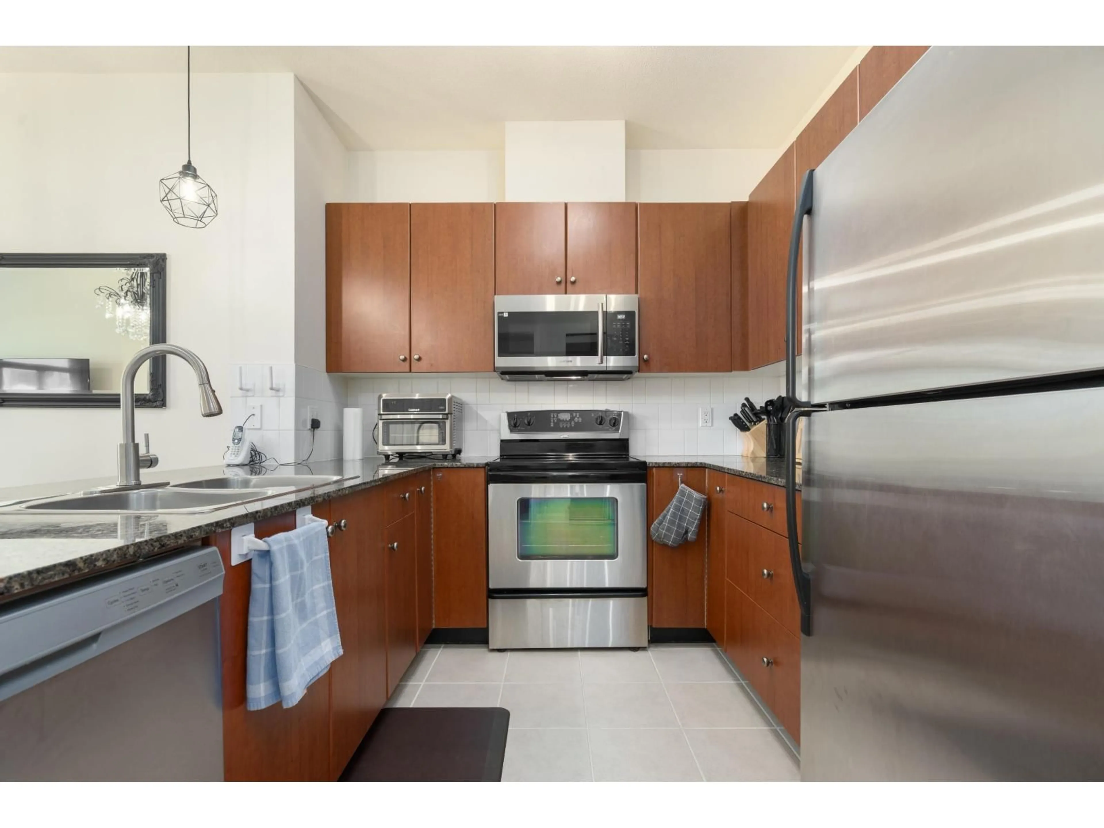 Standard kitchen, ceramic/tile floor for 418 - 10180 153 STREET, Surrey British Columbia V3R0B5