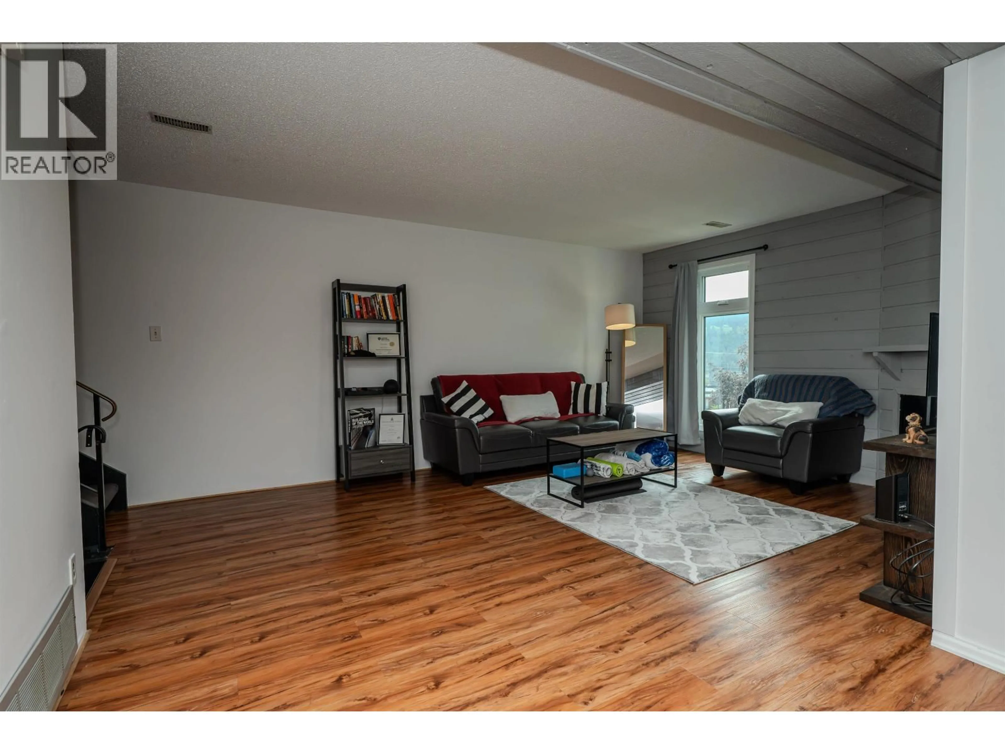 Living room with furniture, wood/laminate floor for 49 - 800 2ND AVENUE, Williams Lake British Columbia V2G4C4