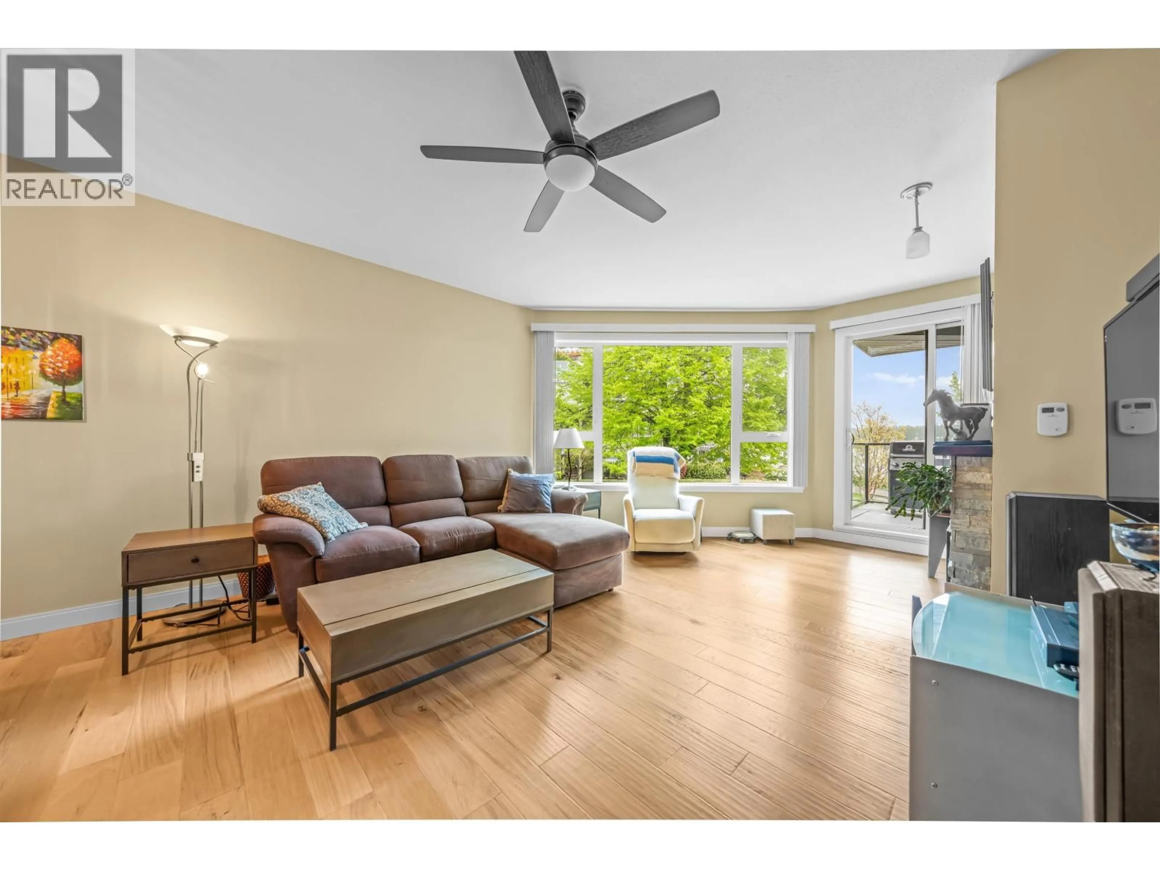 Living room with furniture, wood/laminate floor for 204 - 1150 QUAYSIDE DRIVE, New Westminster British Columbia V3M6E1