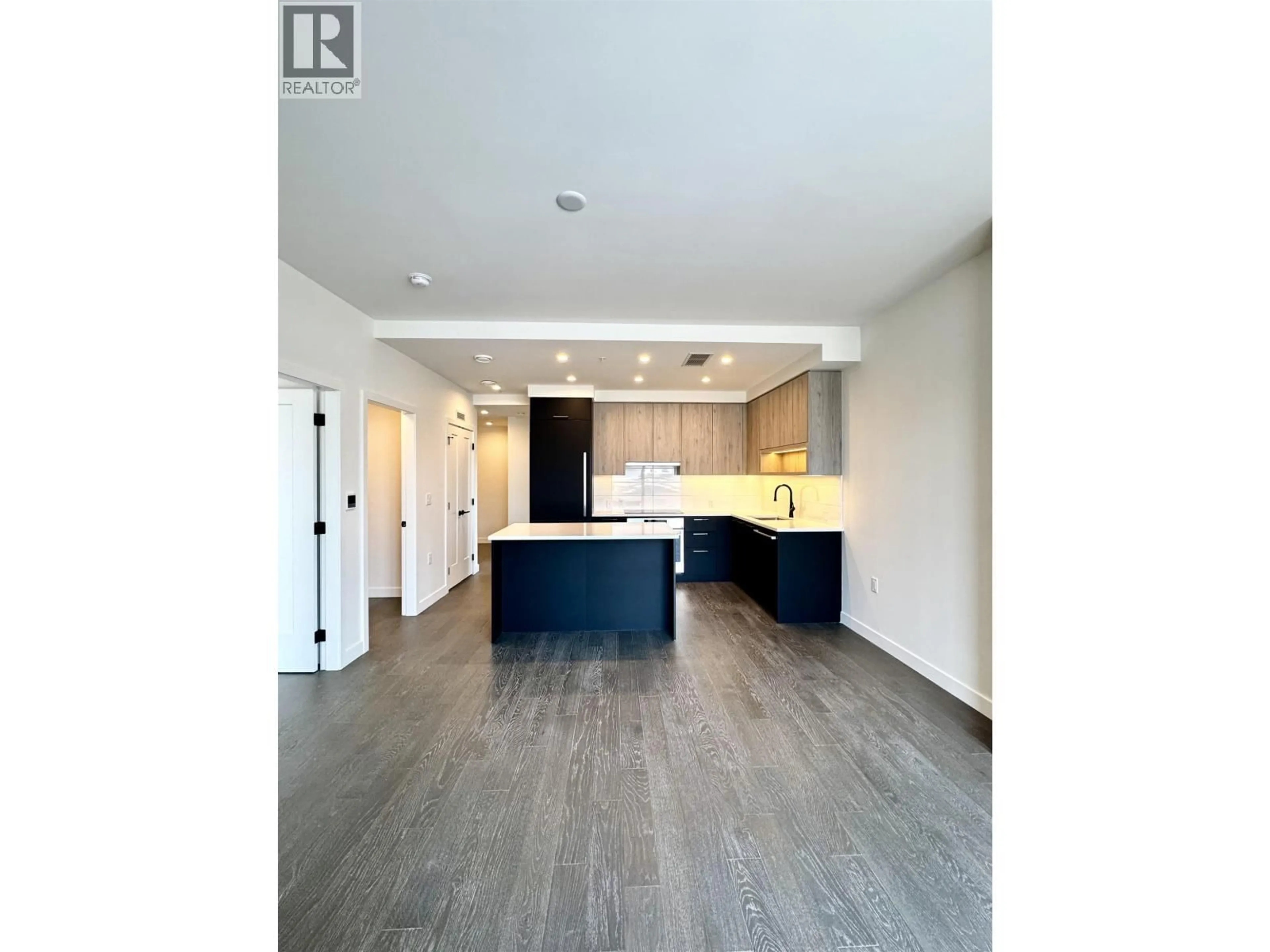 Open concept kitchen, wood/laminate floor for 211 - 8398 OAK STREET, Vancouver British Columbia V6P0L9
