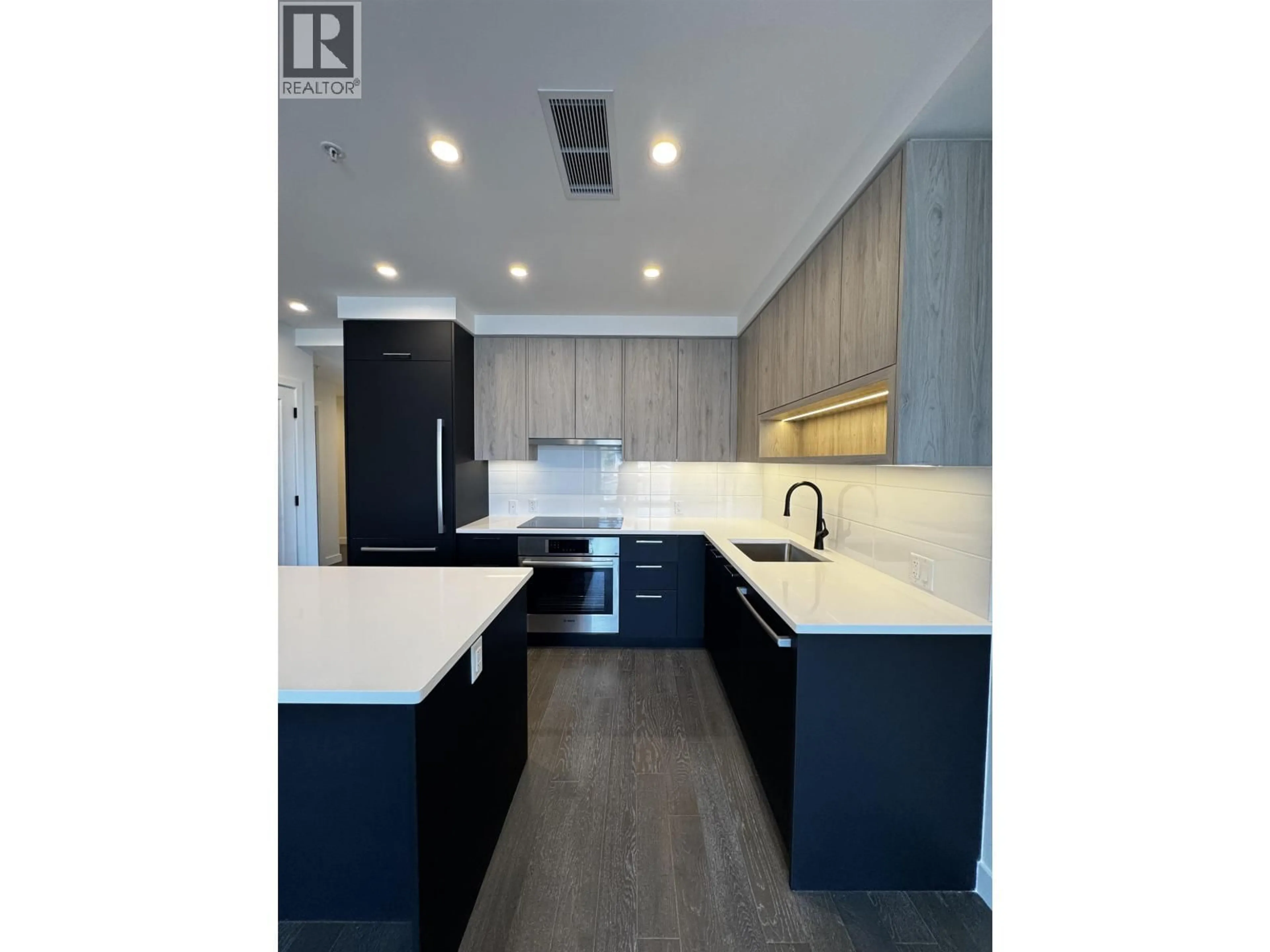 Open concept kitchen, wood/laminate floor for 211 - 8398 OAK STREET, Vancouver British Columbia V6P0L9