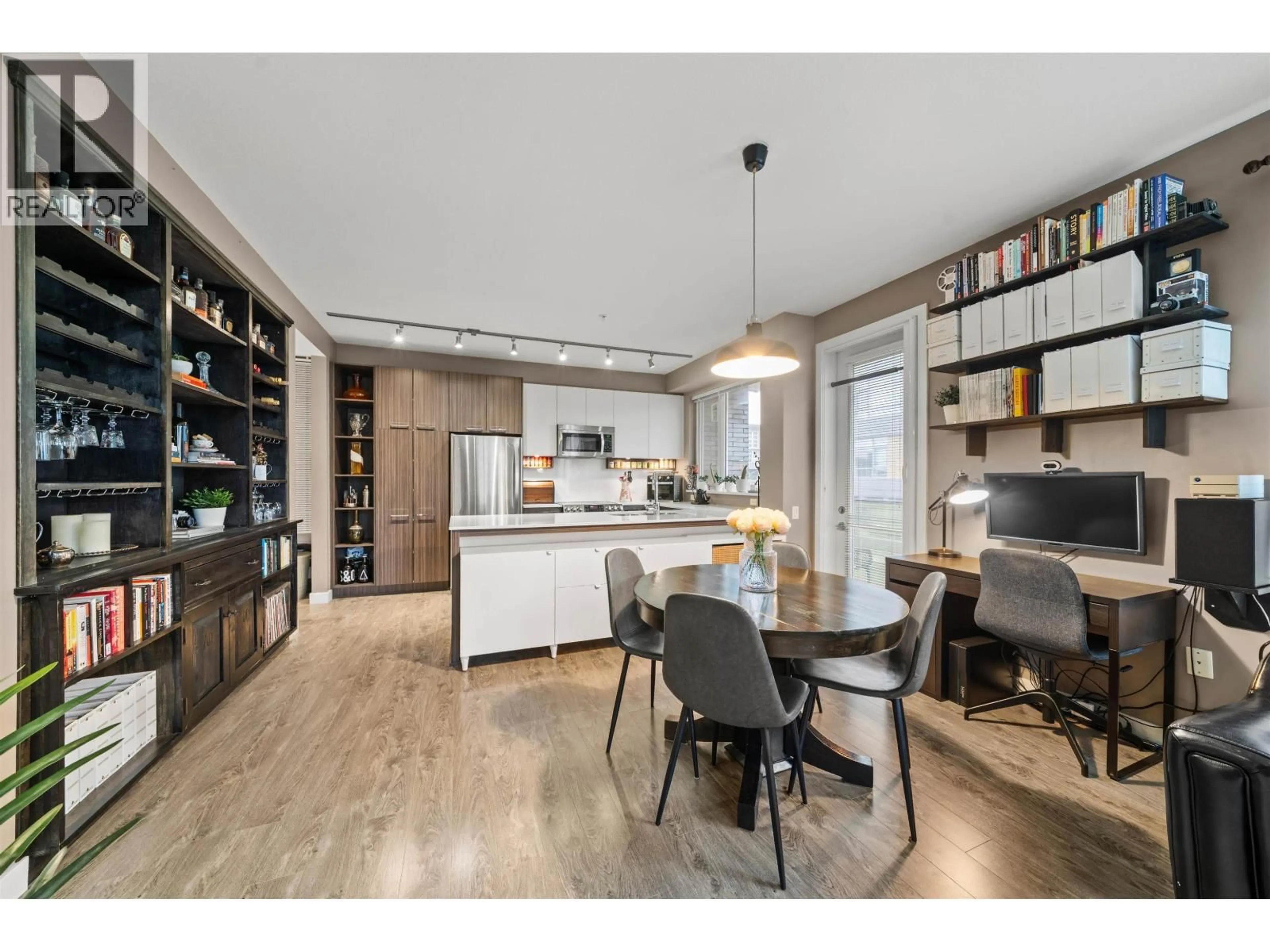 Open concept kitchen, wood/laminate floor for 516 - 9250 UNIVERSITY HIGH STREET, Burnaby British Columbia V5A0B3