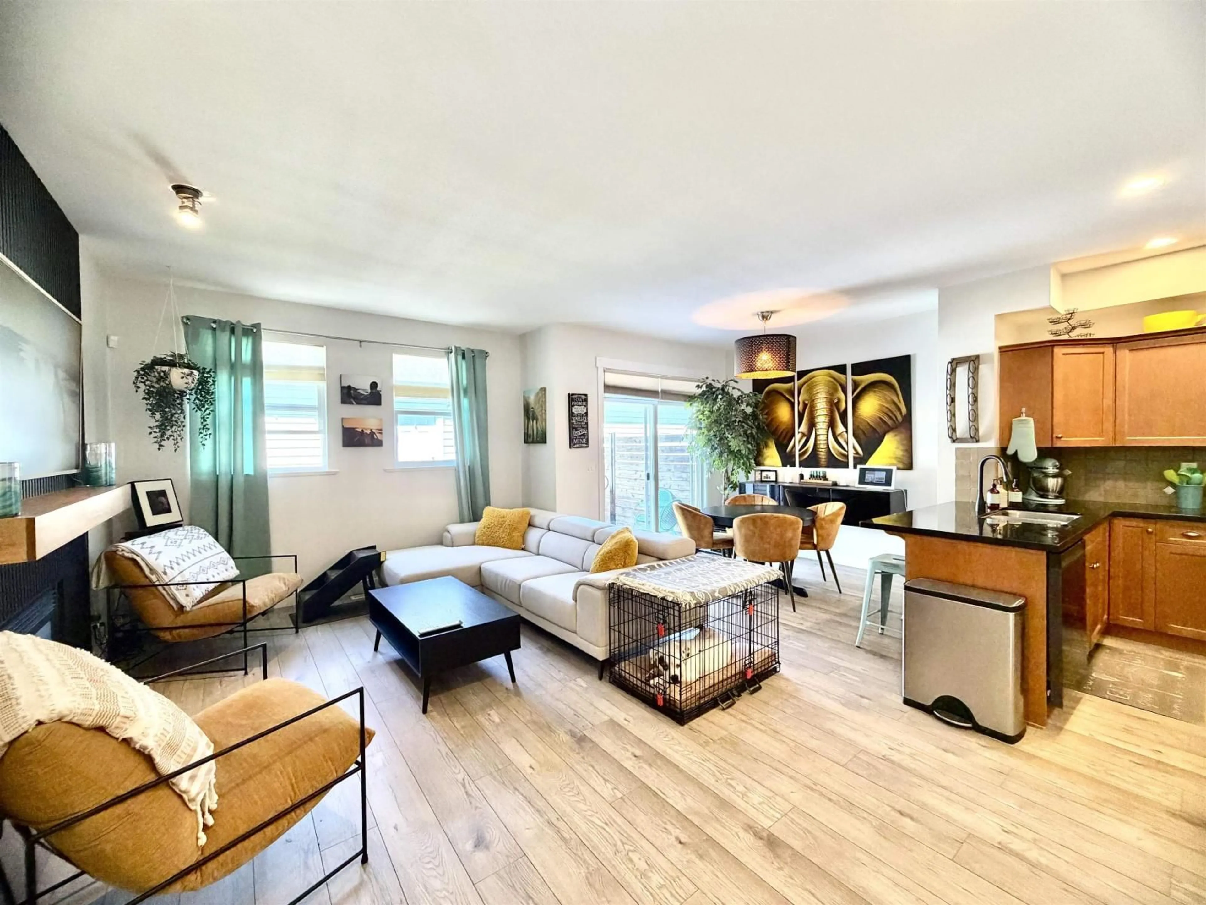 Living room with furniture, wood/laminate floor for 3 - 18011 70 AVENUE, Surrey British Columbia V3S6X3