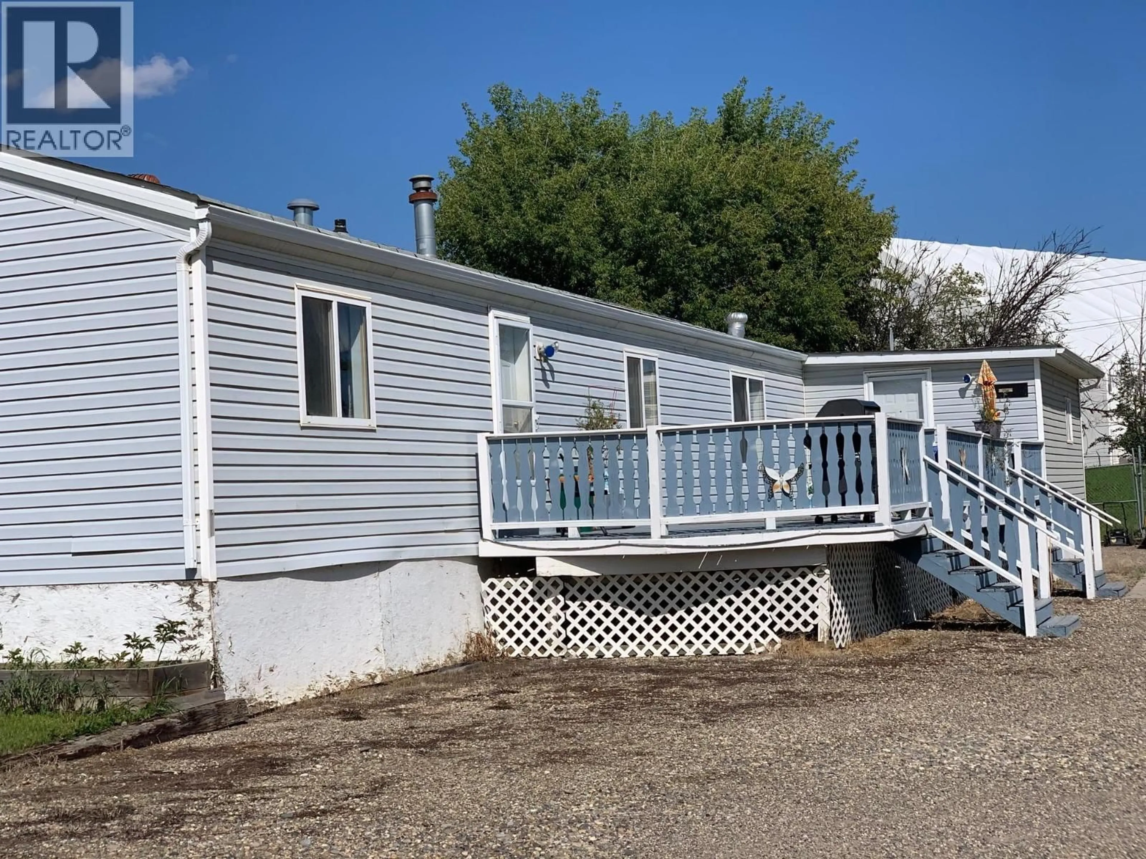 Home with vinyl exterior material, street for 10523 98 STREET, Taylor British Columbia V0C2K0