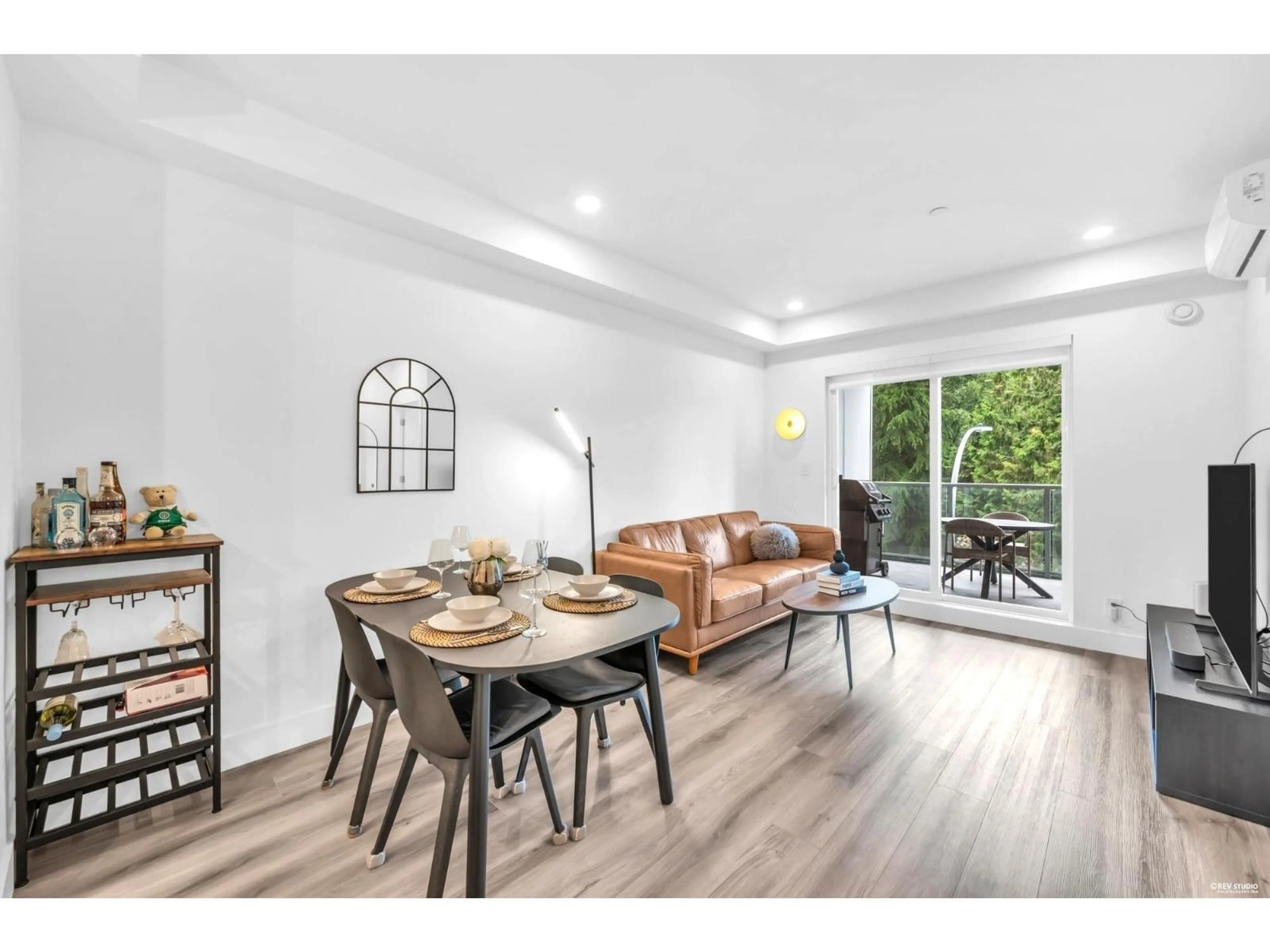 Living room with furniture, wood/laminate floor for A310 - 8447 202 STREET, Langley British Columbia V2Y4K2