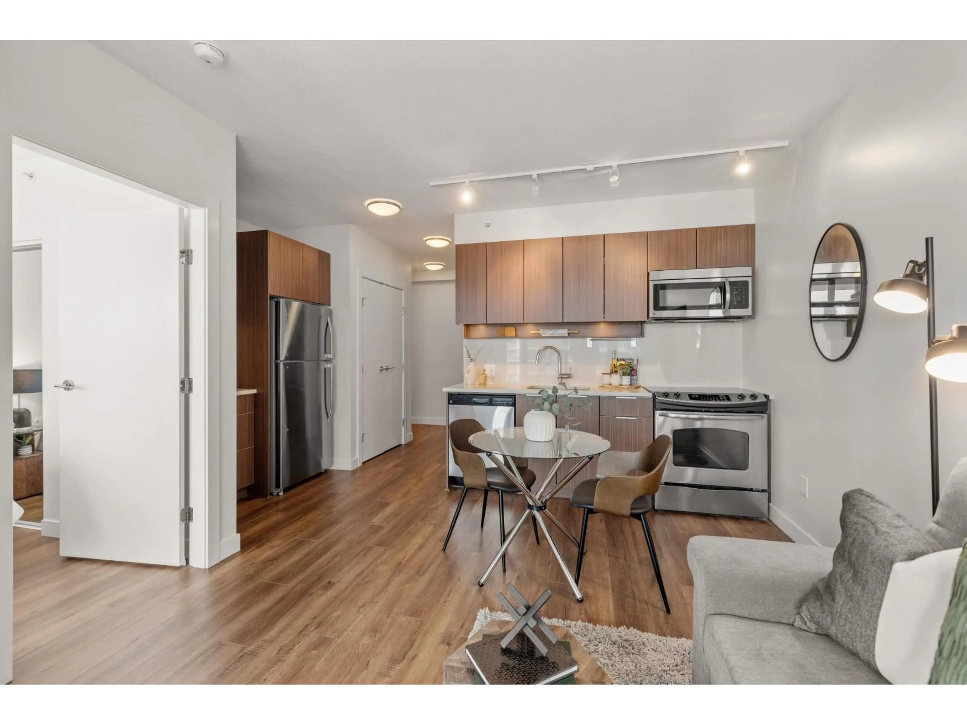 Open concept kitchen, wood/laminate floor for 1201 - 13308 CENTRAL AVENUE, Surrey British Columbia V3T0M4