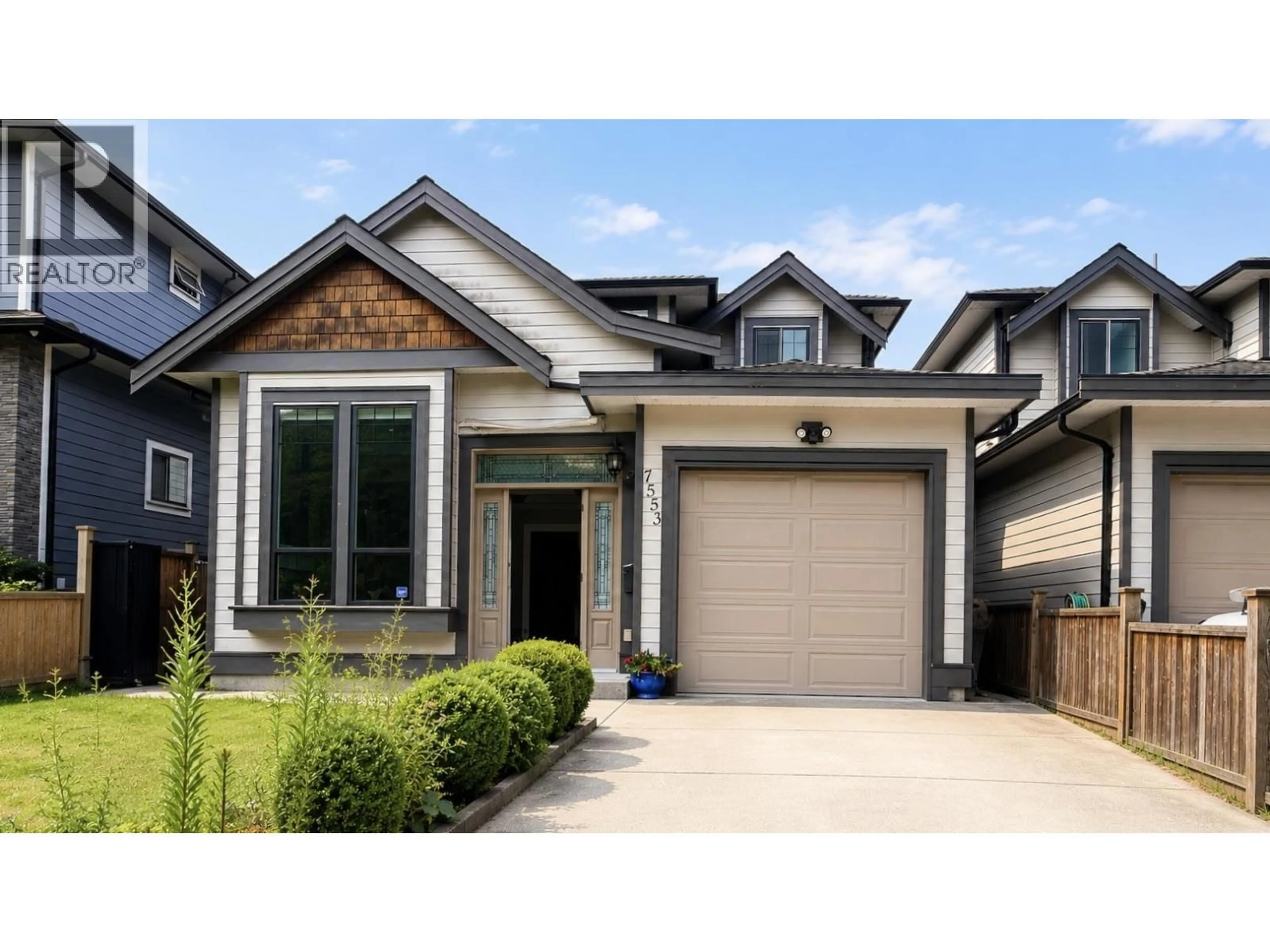 Home with vinyl exterior material, street for 7553 NEWCOMBE STREET, Burnaby British Columbia V3N3V7