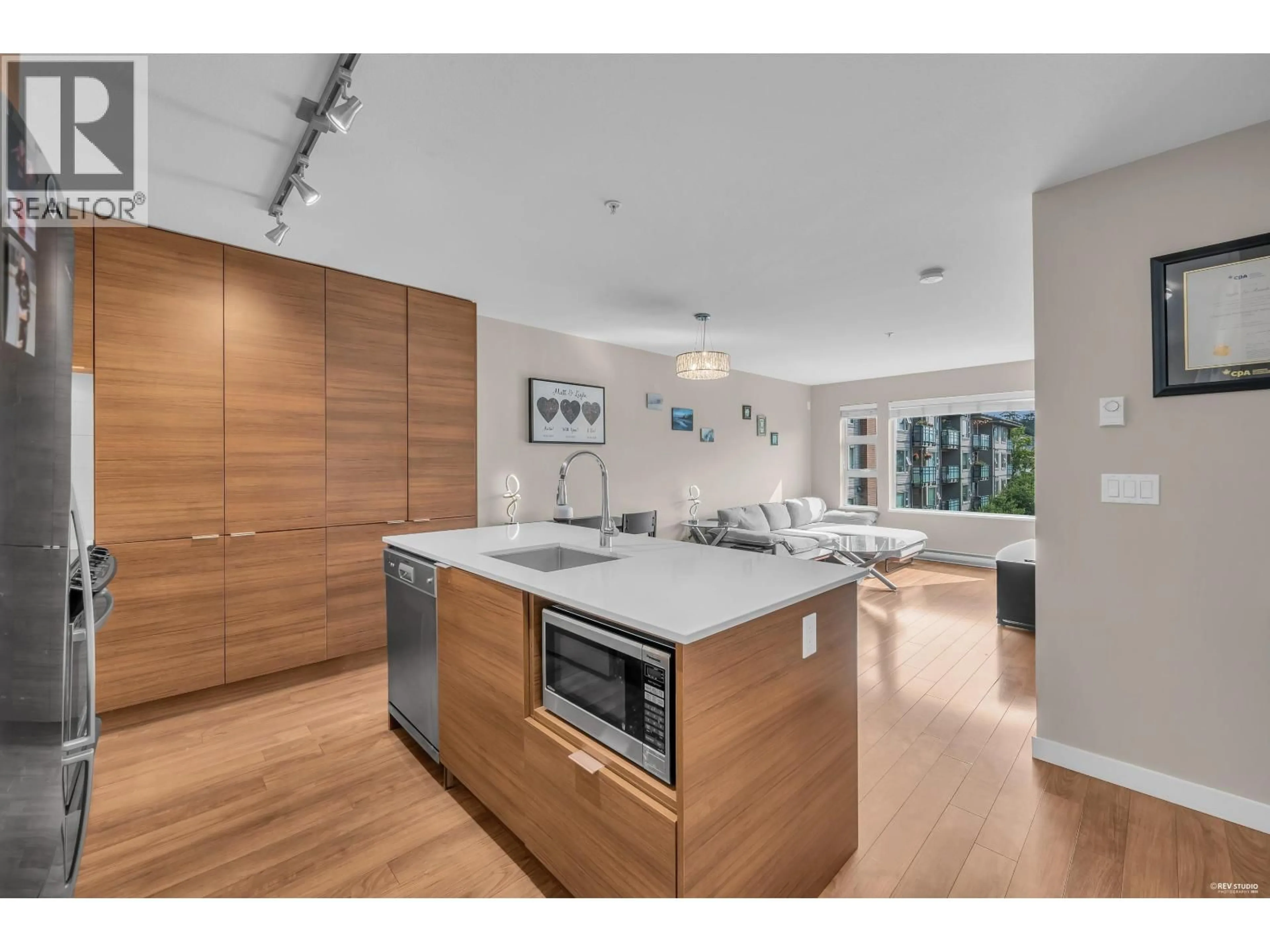 Open concept kitchen, wood/laminate floor for 401 - 1677 LLOYD AVENUE, North Vancouver British Columbia V7P0B1