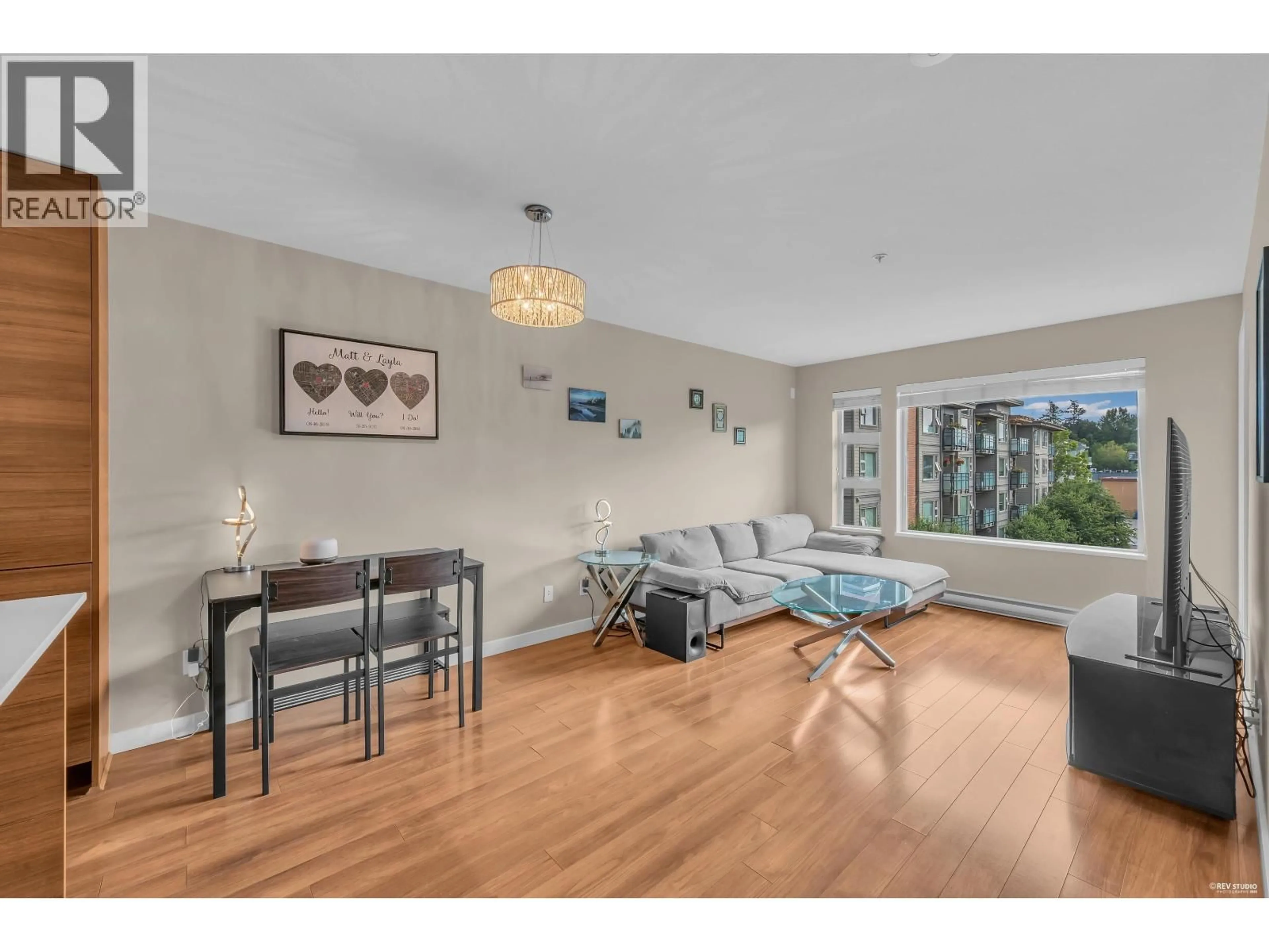 Living room with furniture, wood/laminate floor for 401 - 1677 LLOYD AVENUE, North Vancouver British Columbia V7P0B1