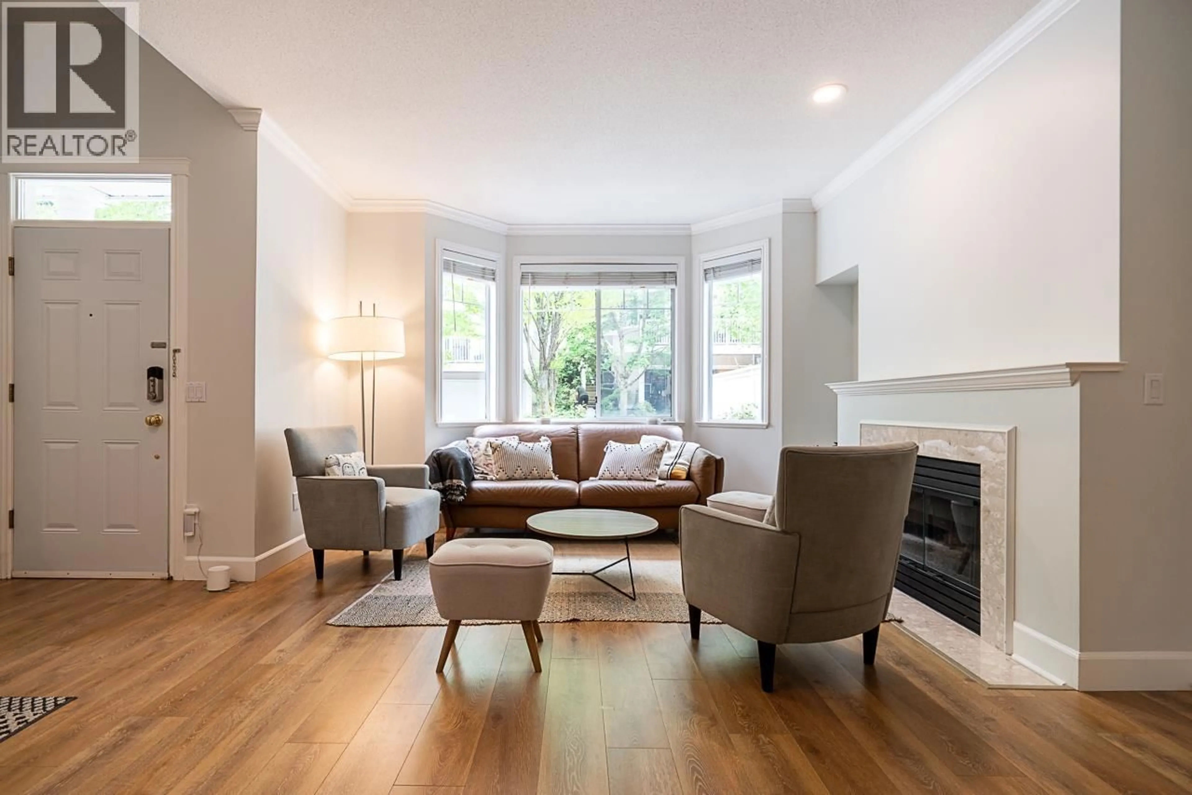 Living room with furniture, wood/laminate floor for 29 - 7501 CUMBERLAND STREET, Burnaby British Columbia V3N4Y6