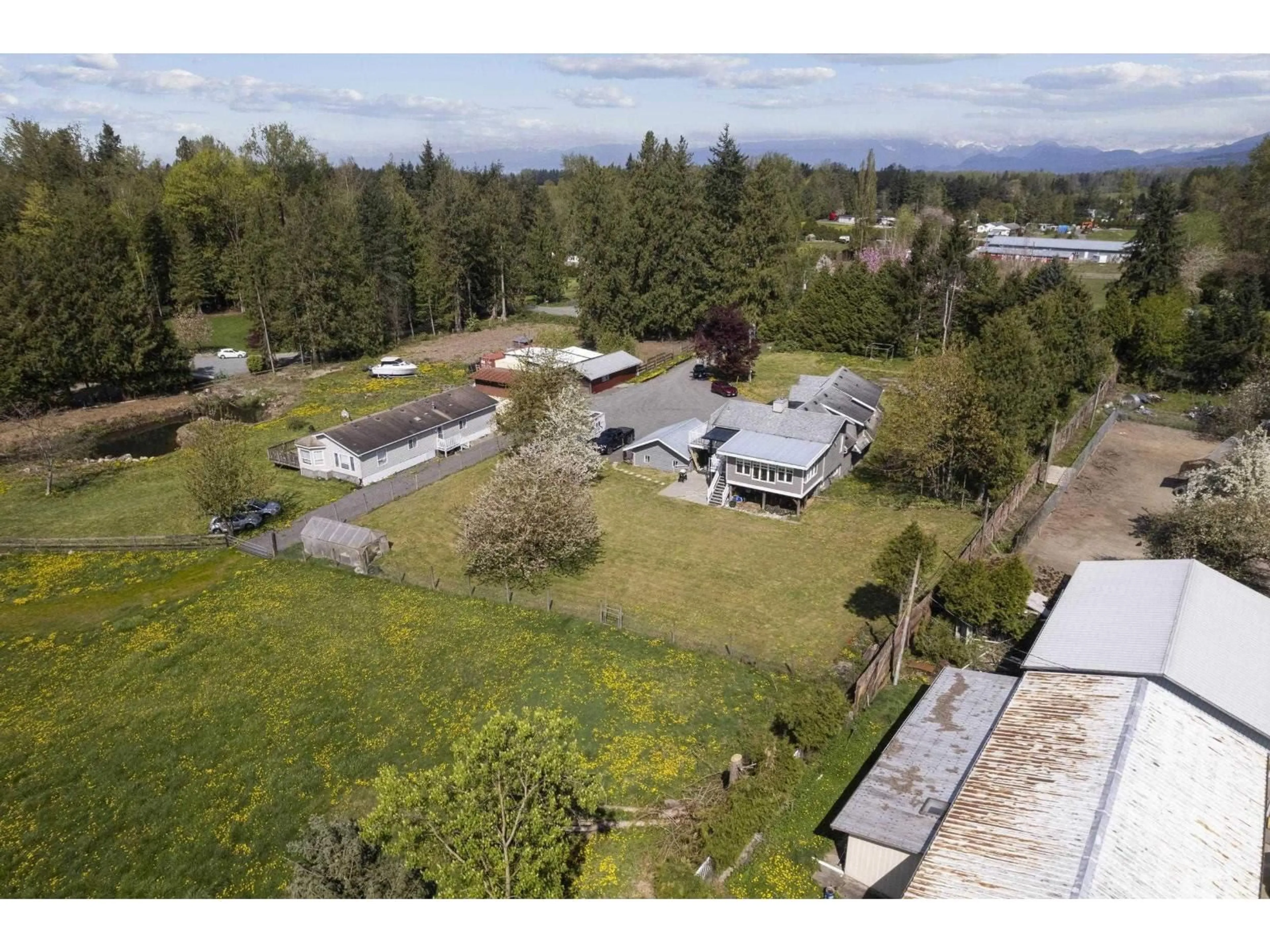 A pic from outside/outdoor area/front of a property/back of a property/a pic from drone, mountain view for 25412 58 AVENUE, Langley British Columbia V4W1G7
