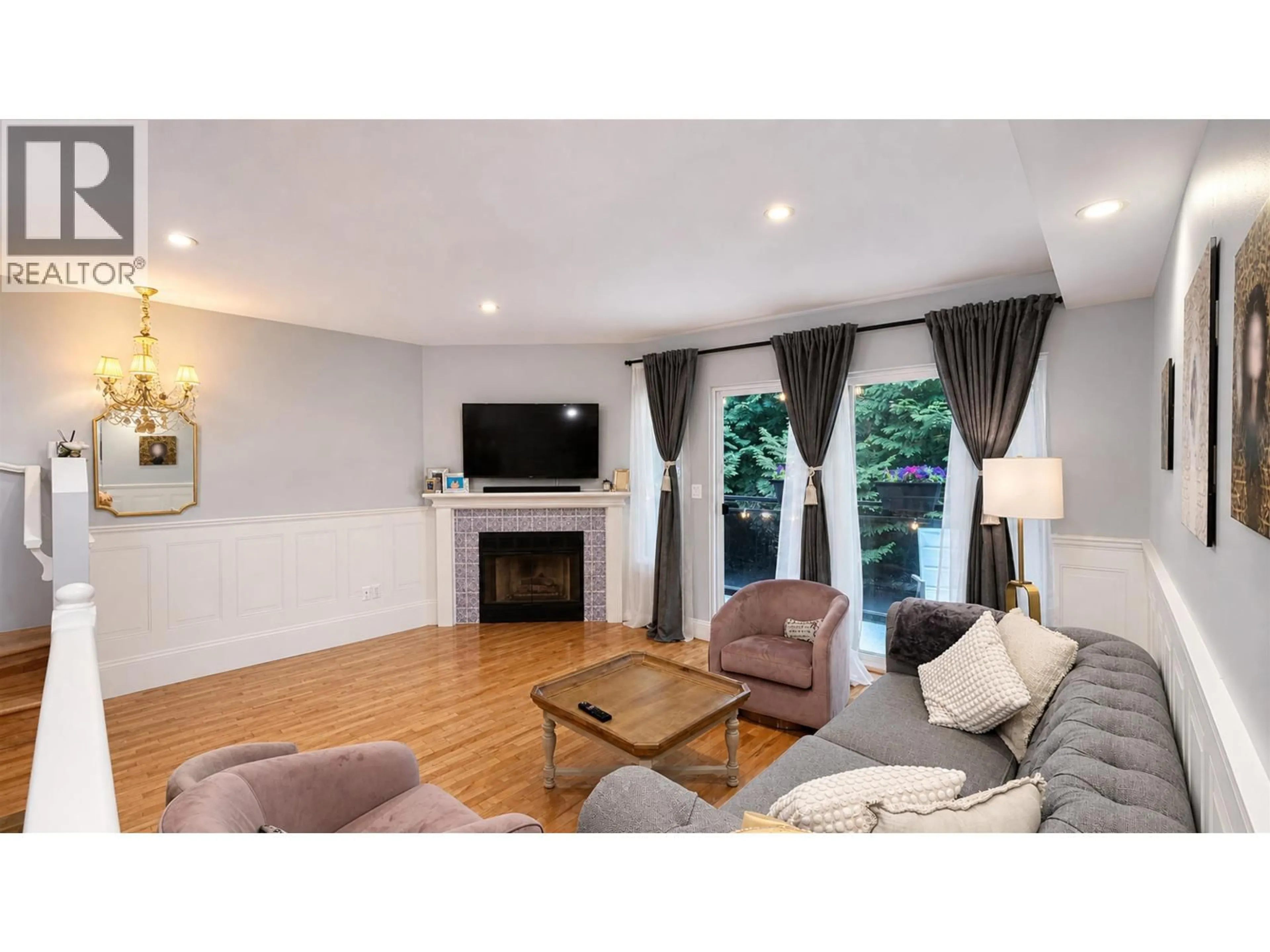 Living room with furniture, wood/laminate floor for 3938 INDIAN RIVER DRIVE, North Vancouver British Columbia V7G2G9