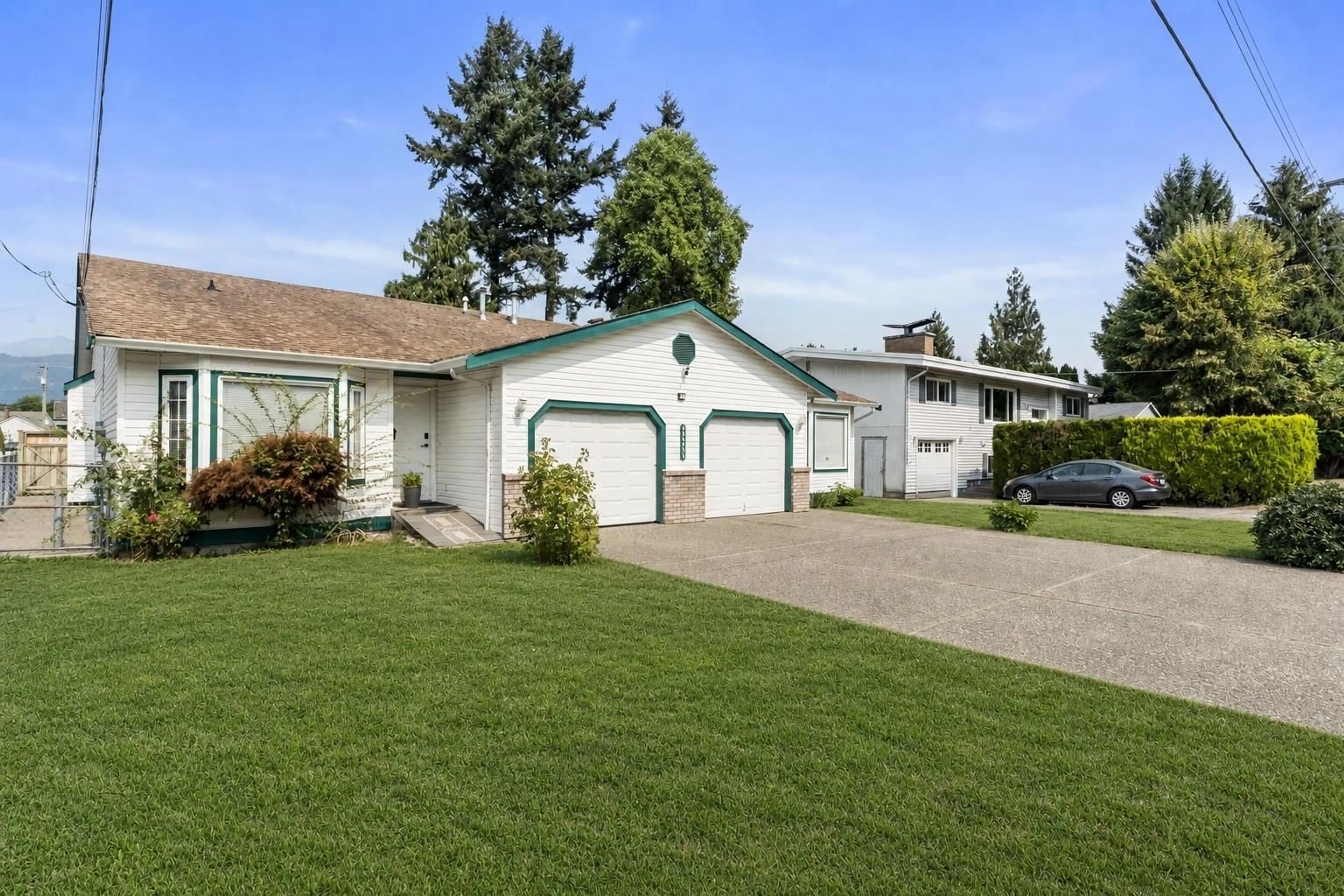 Home with vinyl exterior material, street for 1&2 - 46043 MELLARD AVENUE, Chilliwack British Columbia V2P2Y8