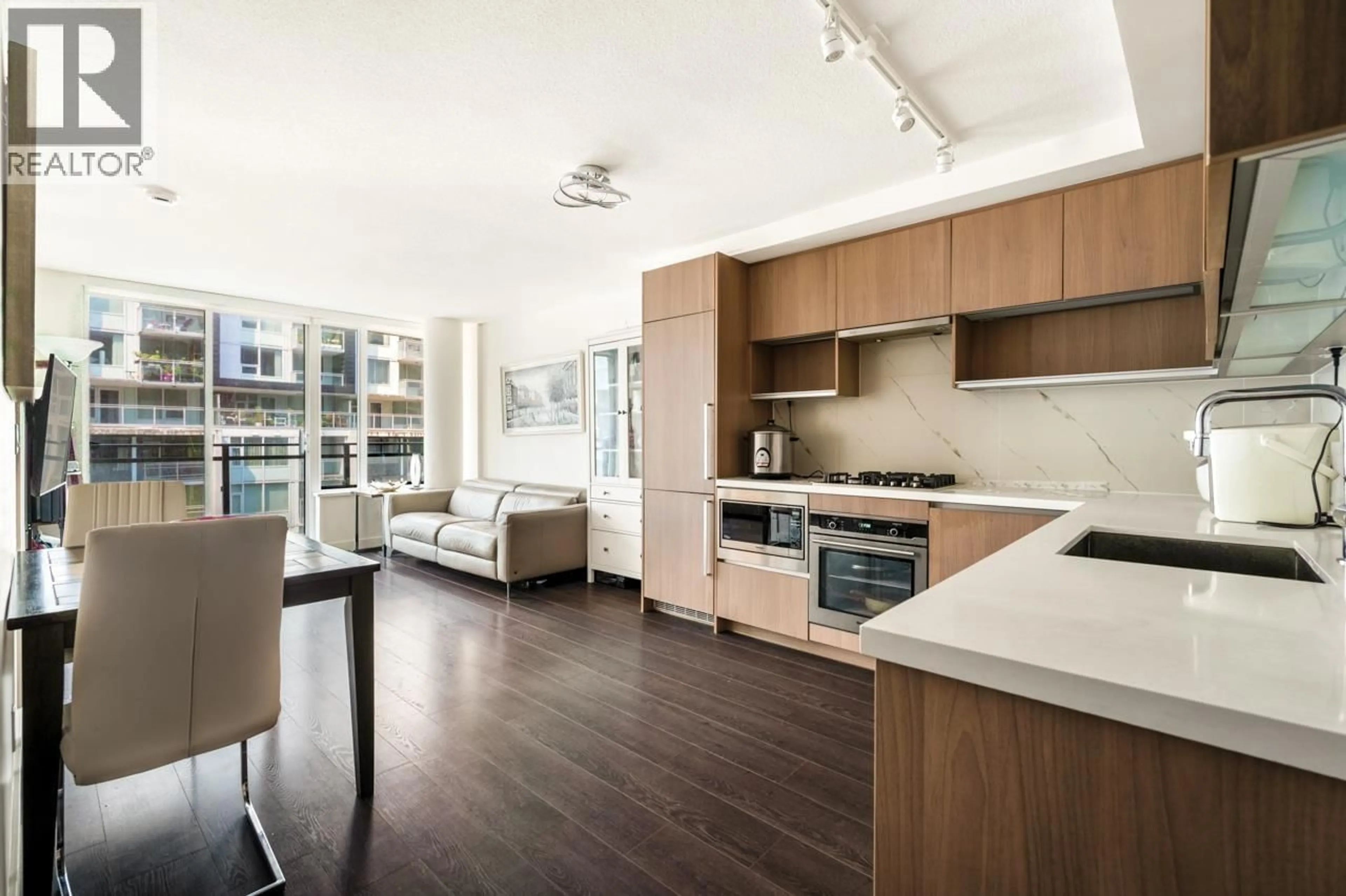Open concept kitchen, wood/laminate floor for 607 - 8833 HAZELBRIDGE WAY, Richmond British Columbia V6X0N3
