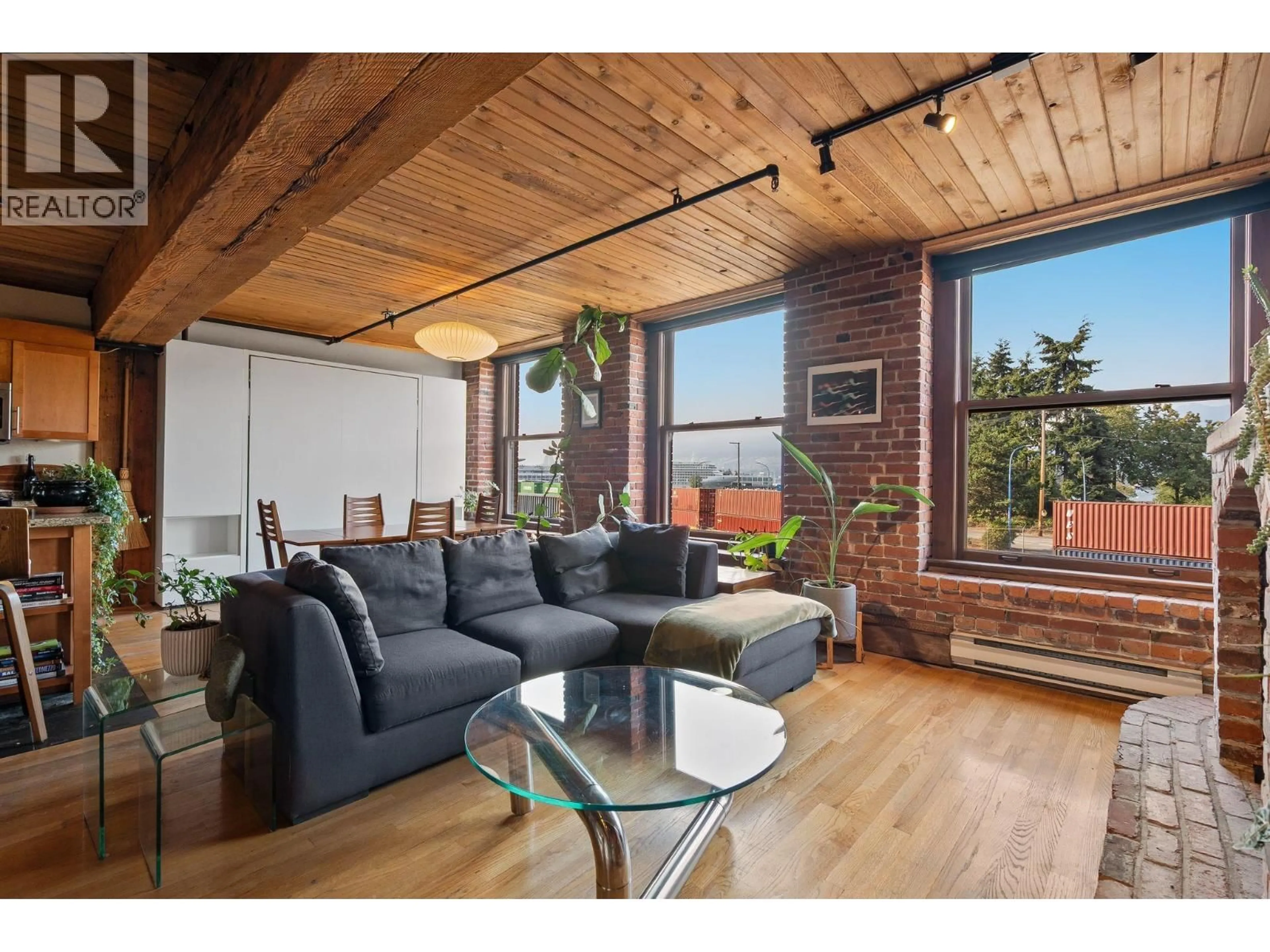Living room with furniture, wood/laminate floor for 305 - 41 ALEXANDER STREET, Vancouver British Columbia V6A1B2