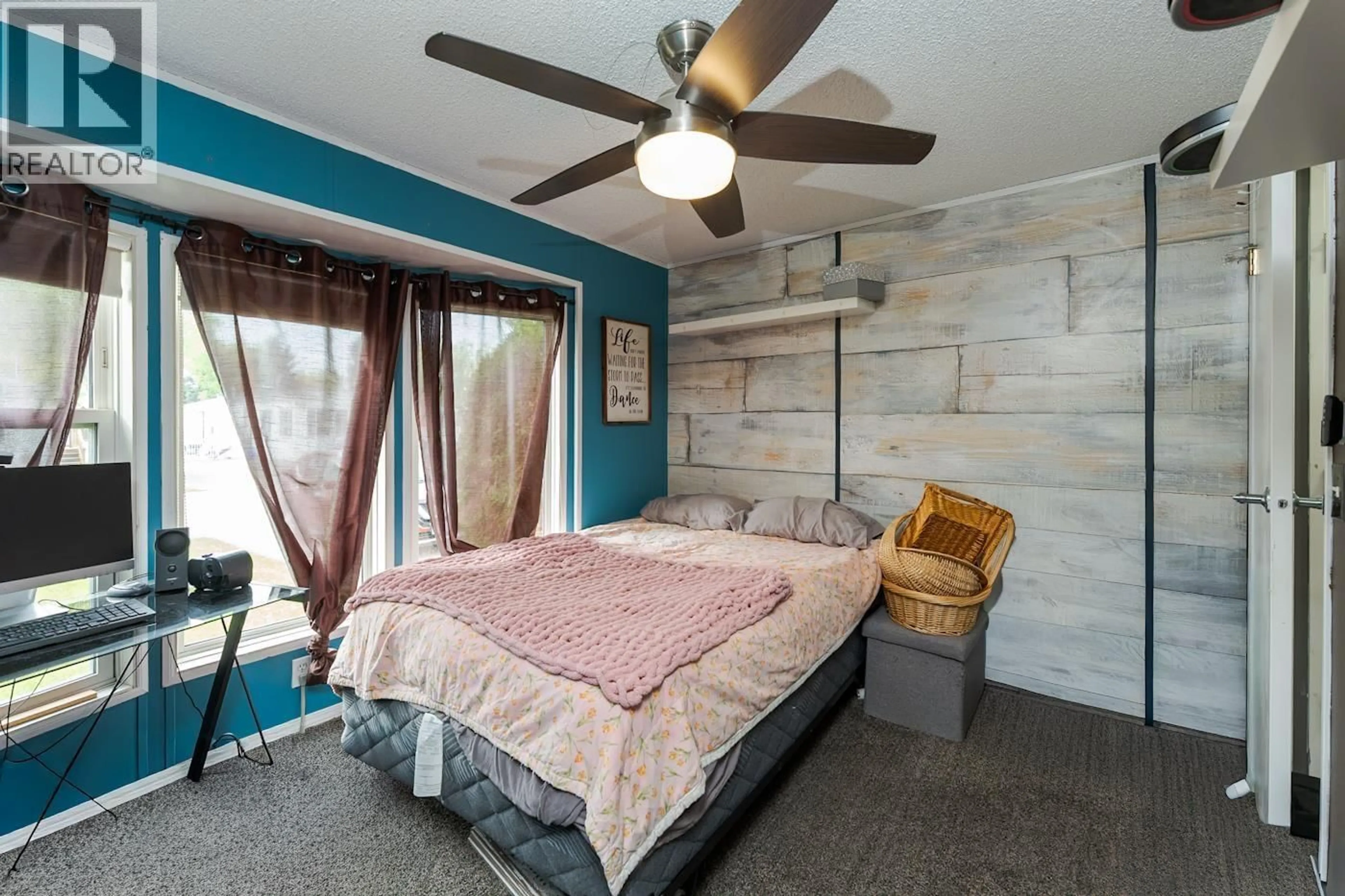 Bedroom with bed, wood/laminate floor for 10 - 7100 ALDEEN ROAD, Prince George British Columbia V2N5R5