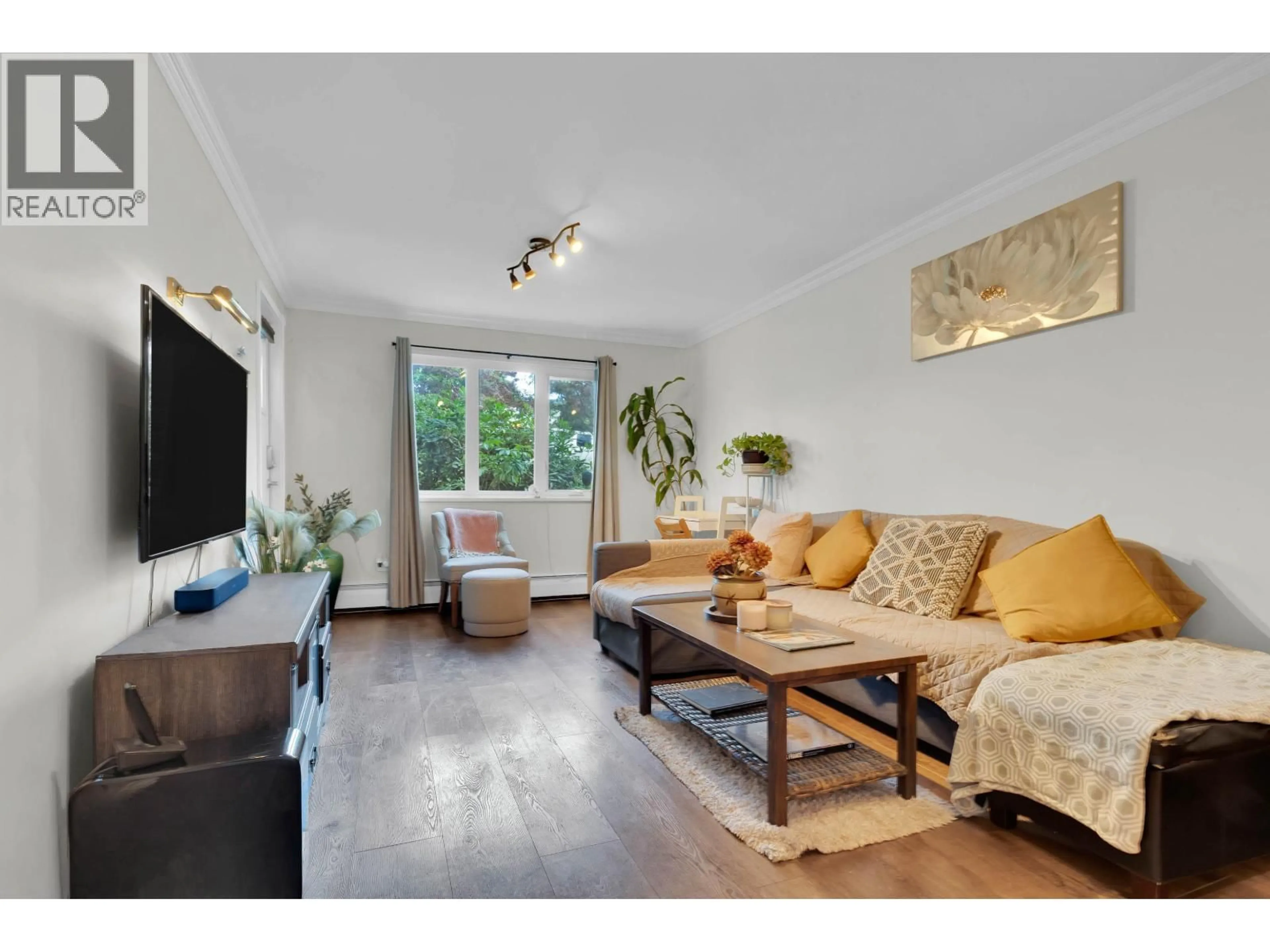 Living room with furniture, wood/laminate floor for 106 - 1122 KING ALBERT AVENUE, Coquitlam British Columbia V3J1X7