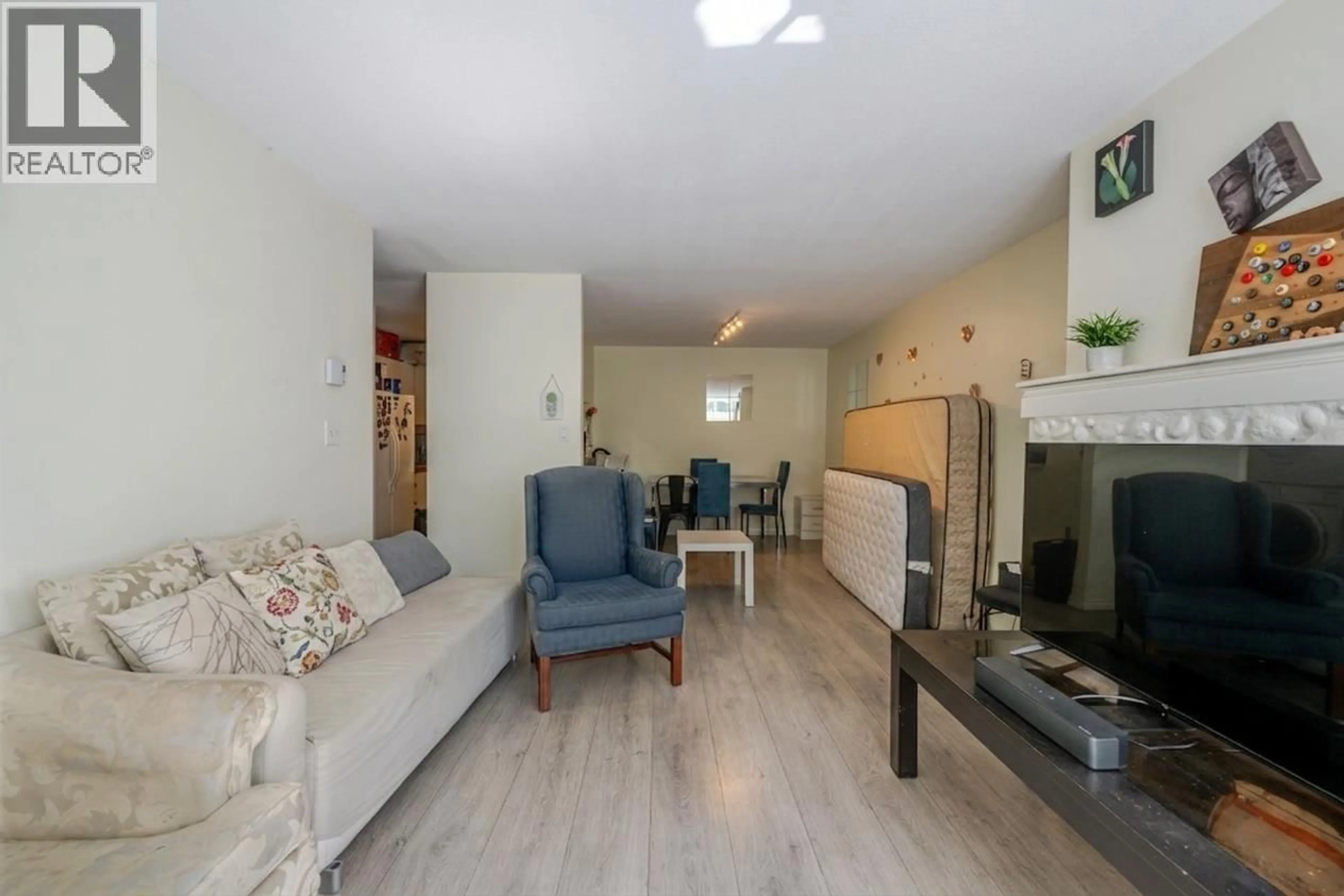 Living room with furniture, unknown for 105 - 7431 BLUNDELL ROAD, Richmond British Columbia V6Y3G8
