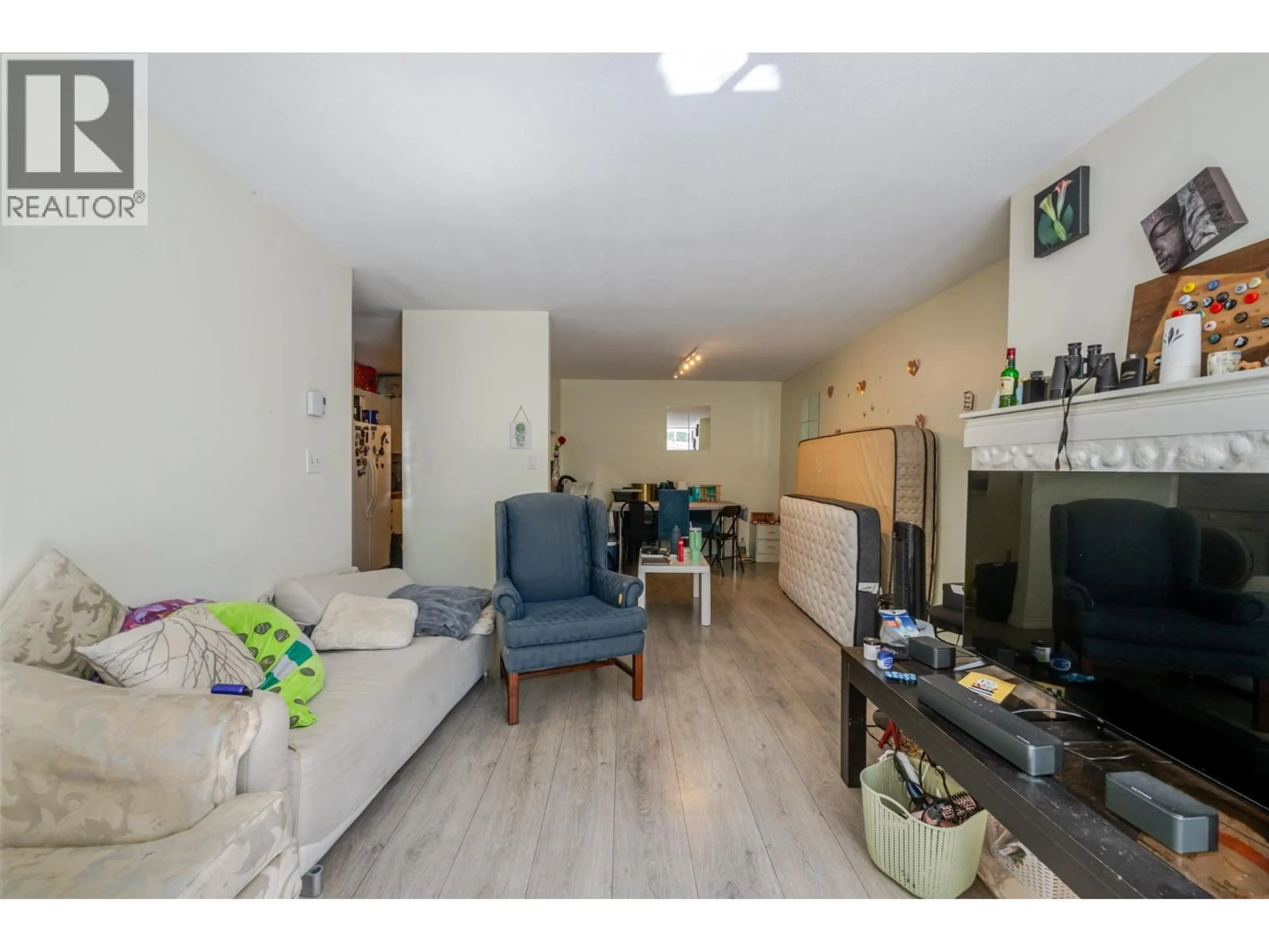 Living room with furniture, unknown for 105 - 7431 BLUNDELL ROAD, Richmond British Columbia V6Y3G8