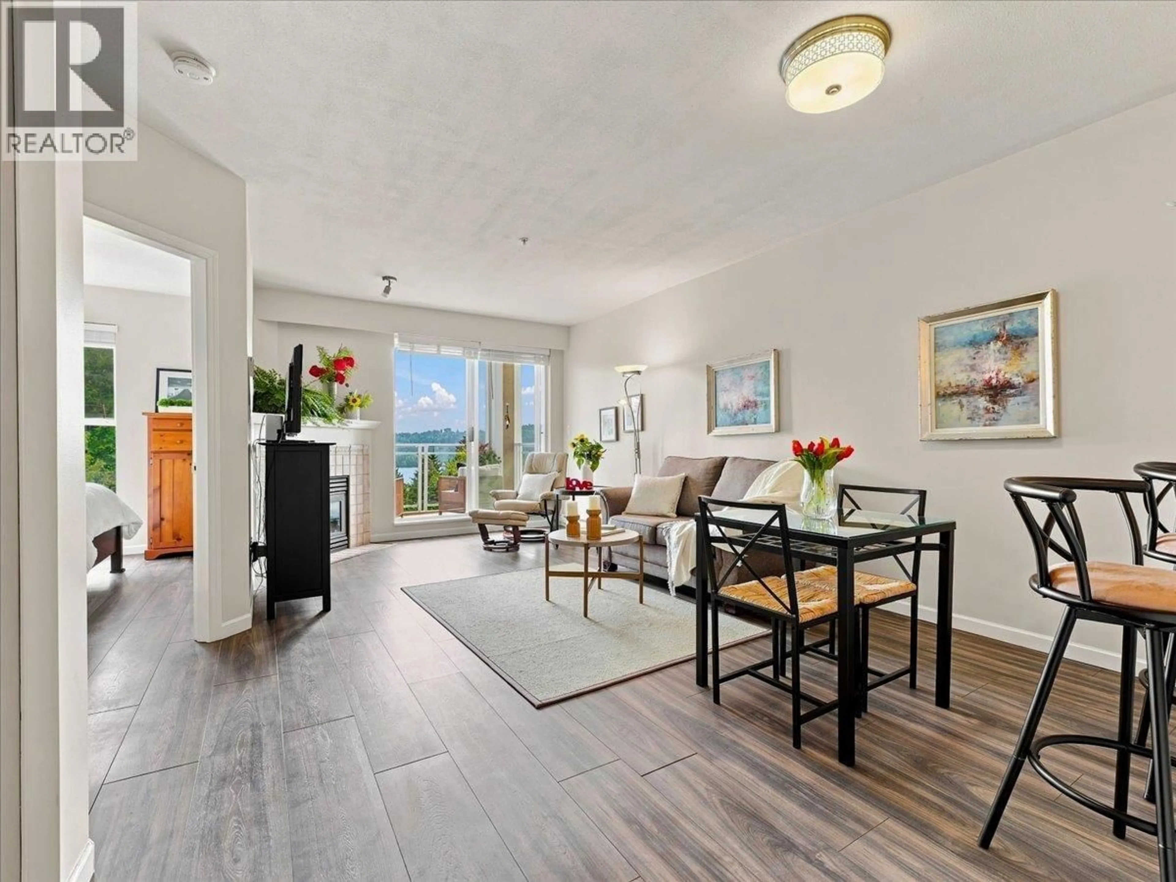 Living room with furniture, wood/laminate floor for 317 - 3629 DEERCREST DRIVE, North Vancouver British Columbia V7G2S9