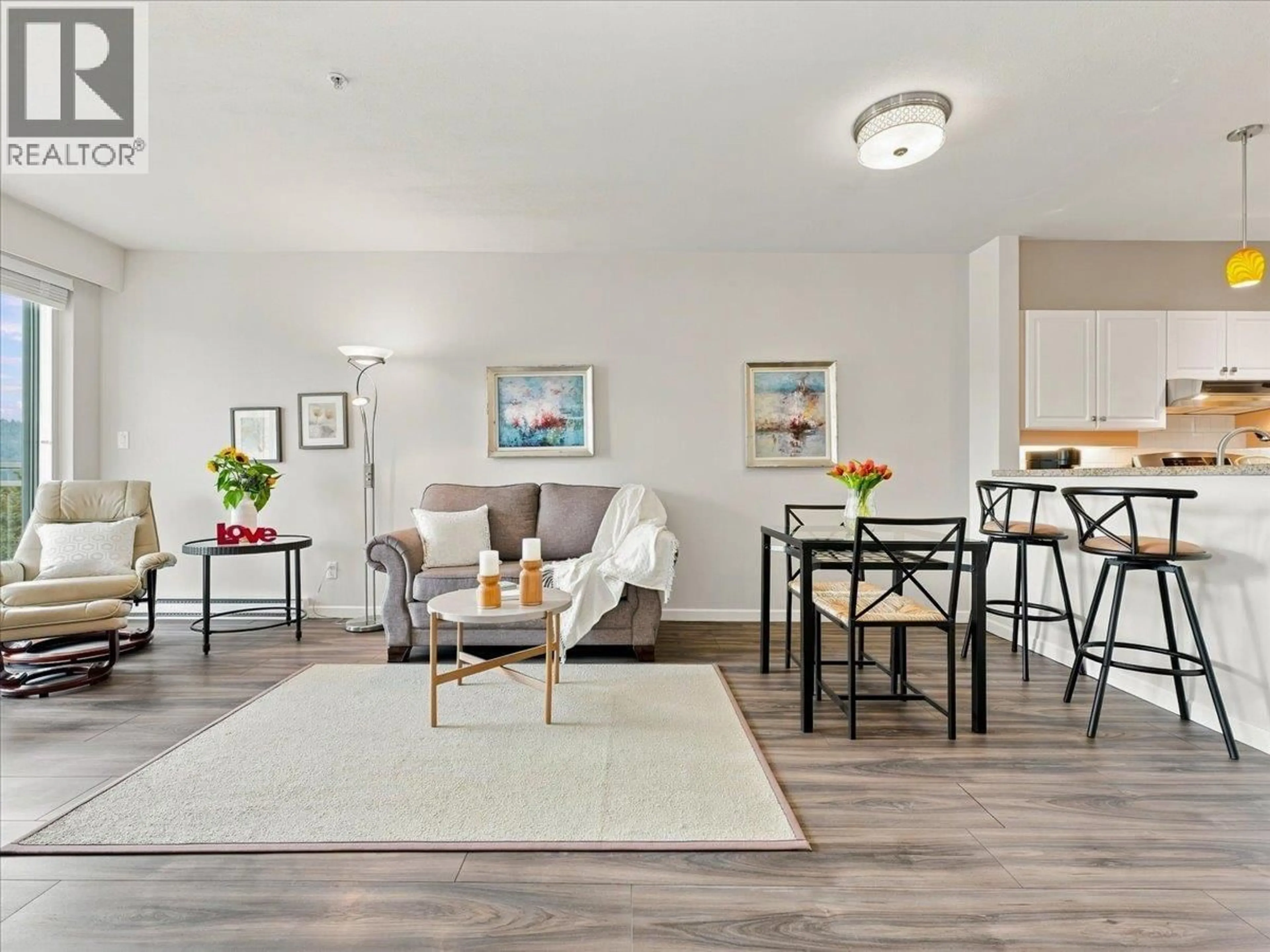 Living room with furniture, wood/laminate floor for 317 - 3629 DEERCREST DRIVE, North Vancouver British Columbia V7G2S9