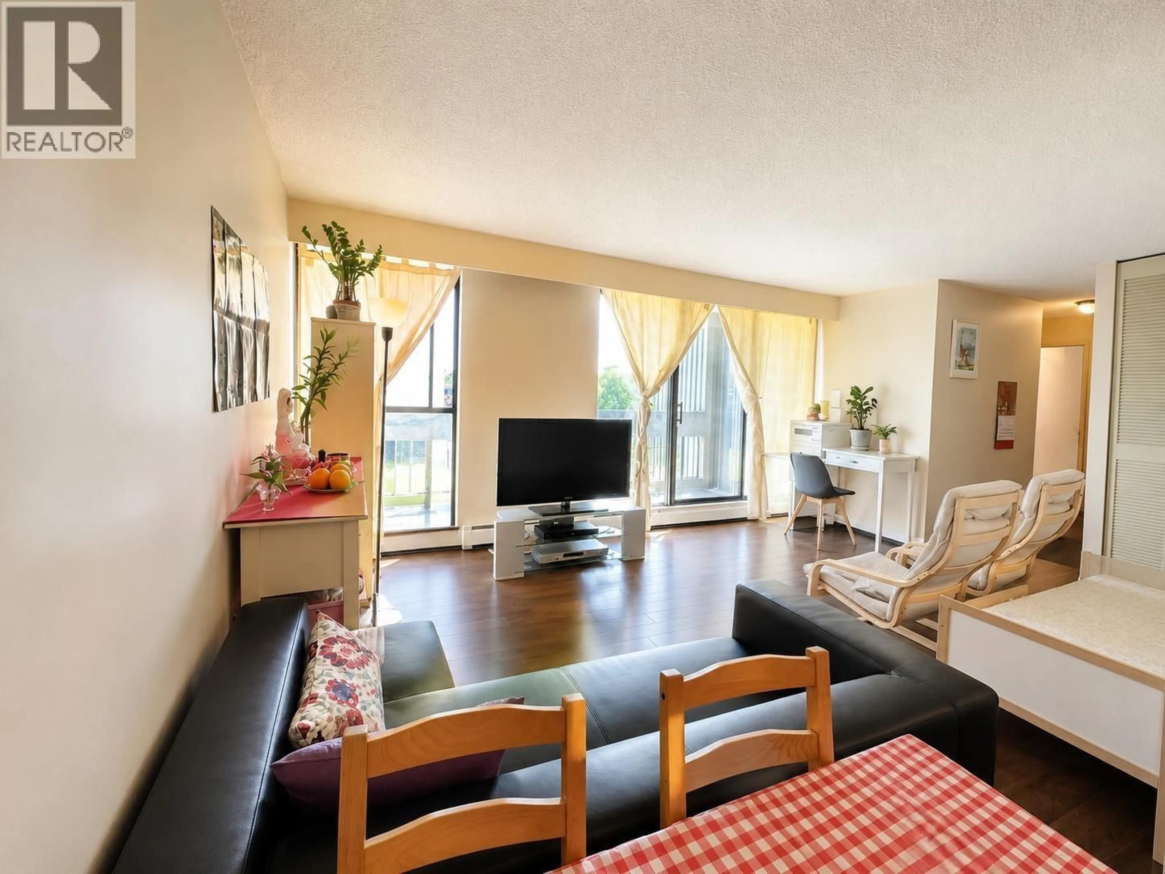 Living room with furniture, wood/laminate floor for 502 - 4105 IMPERIAL STREET, Burnaby British Columbia V5J1A6