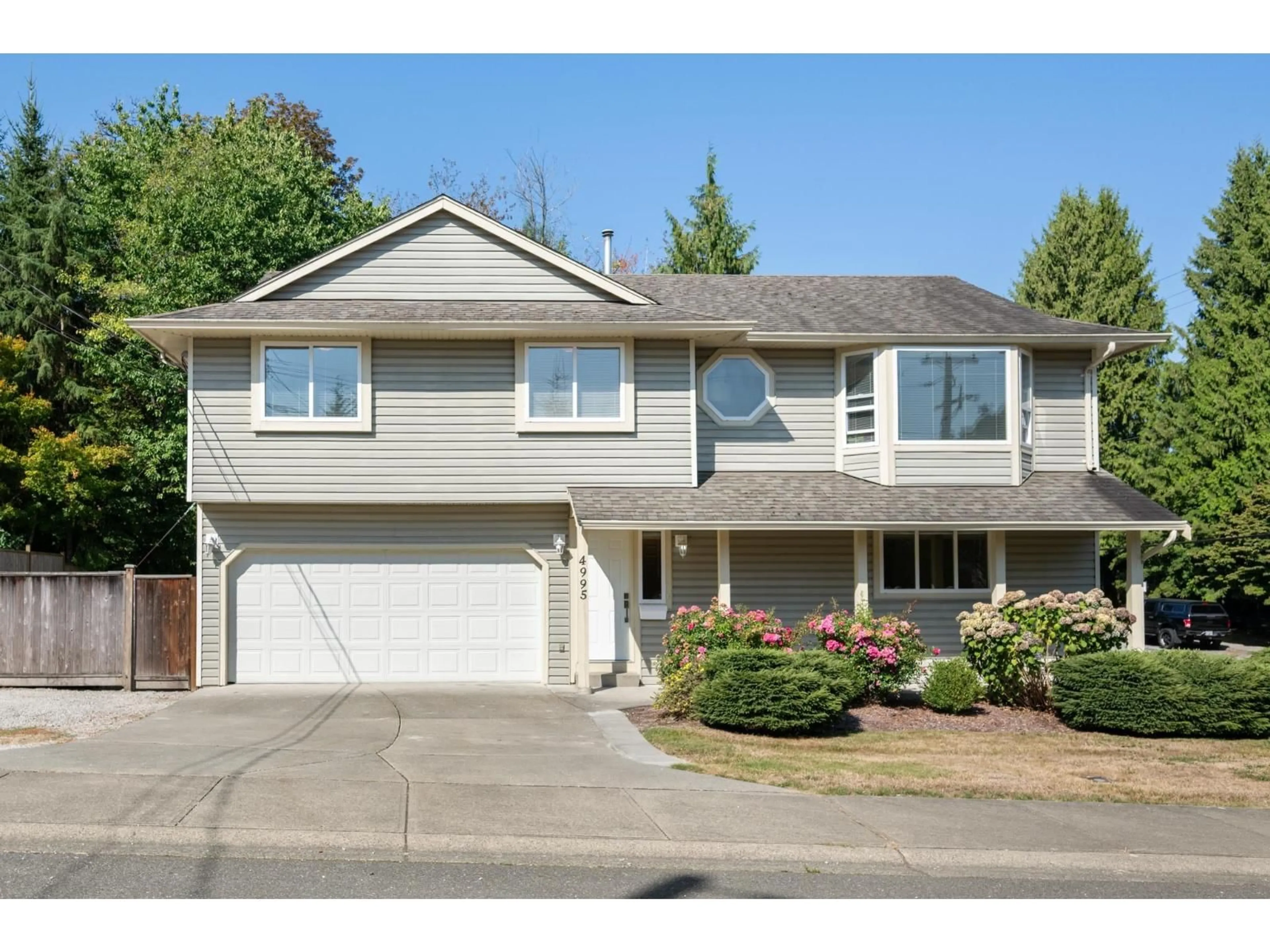 Home with vinyl exterior material, street for 4995 202A STREET, Langley British Columbia V3A1T6