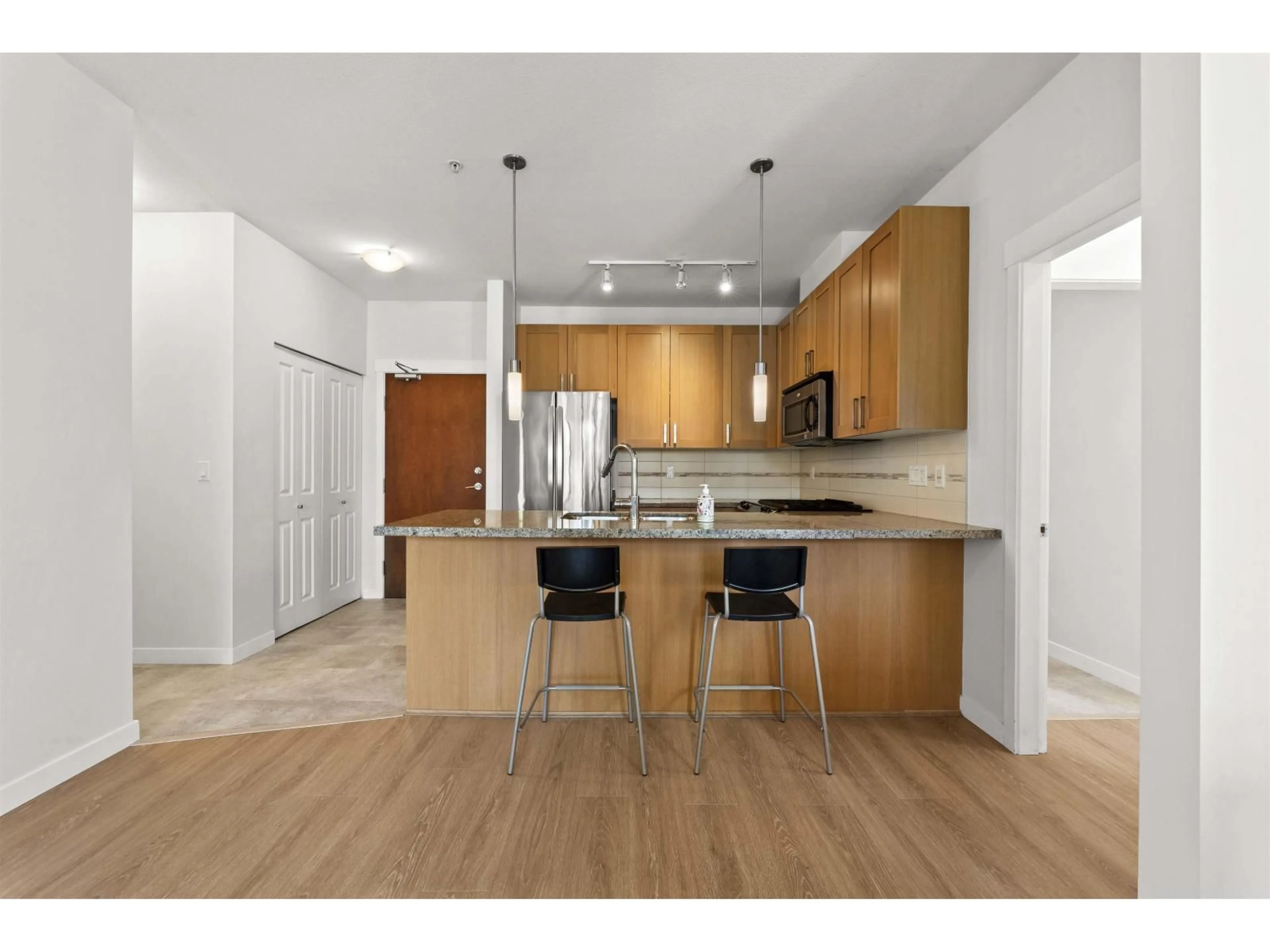 Open concept kitchen, wood/laminate floor for 232 - 15918 26 AVENUE, Surrey British Columbia V3Z5K3