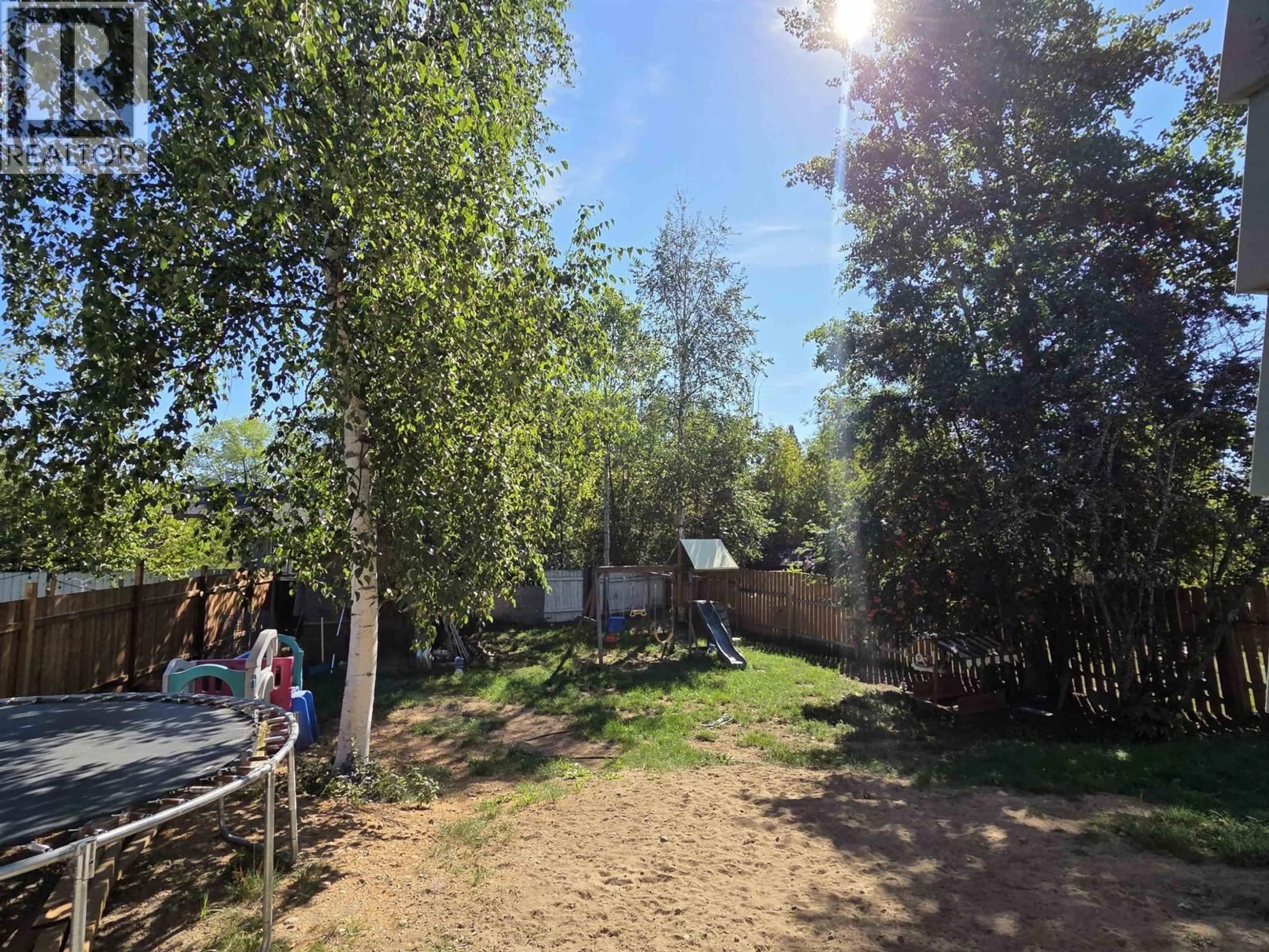 A pic from outside/outdoor area/front of a property/back of a property/a pic from drone, forest/trees view for 7078 HARVARD CRESCENT, Prince George British Columbia V2N2V7