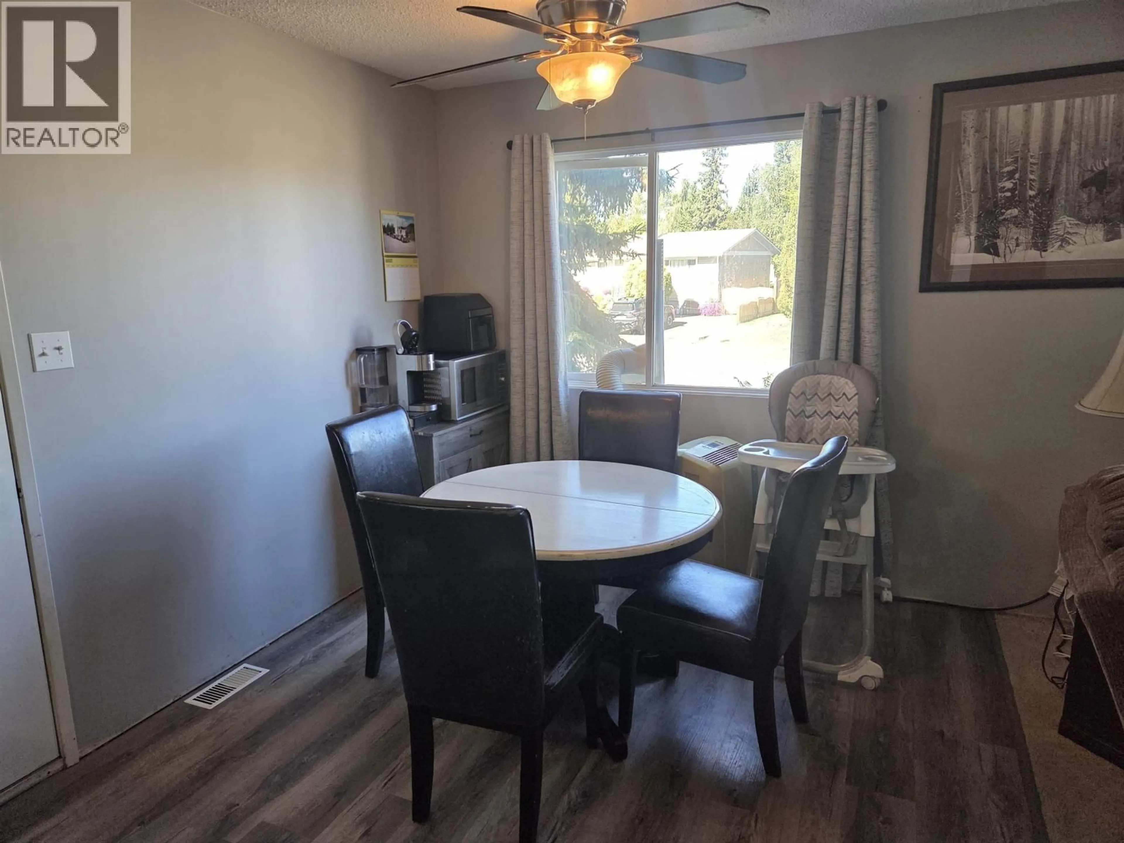 Dining room, wood/laminate floor for 7078 HARVARD CRESCENT, Prince George British Columbia V2N2V7