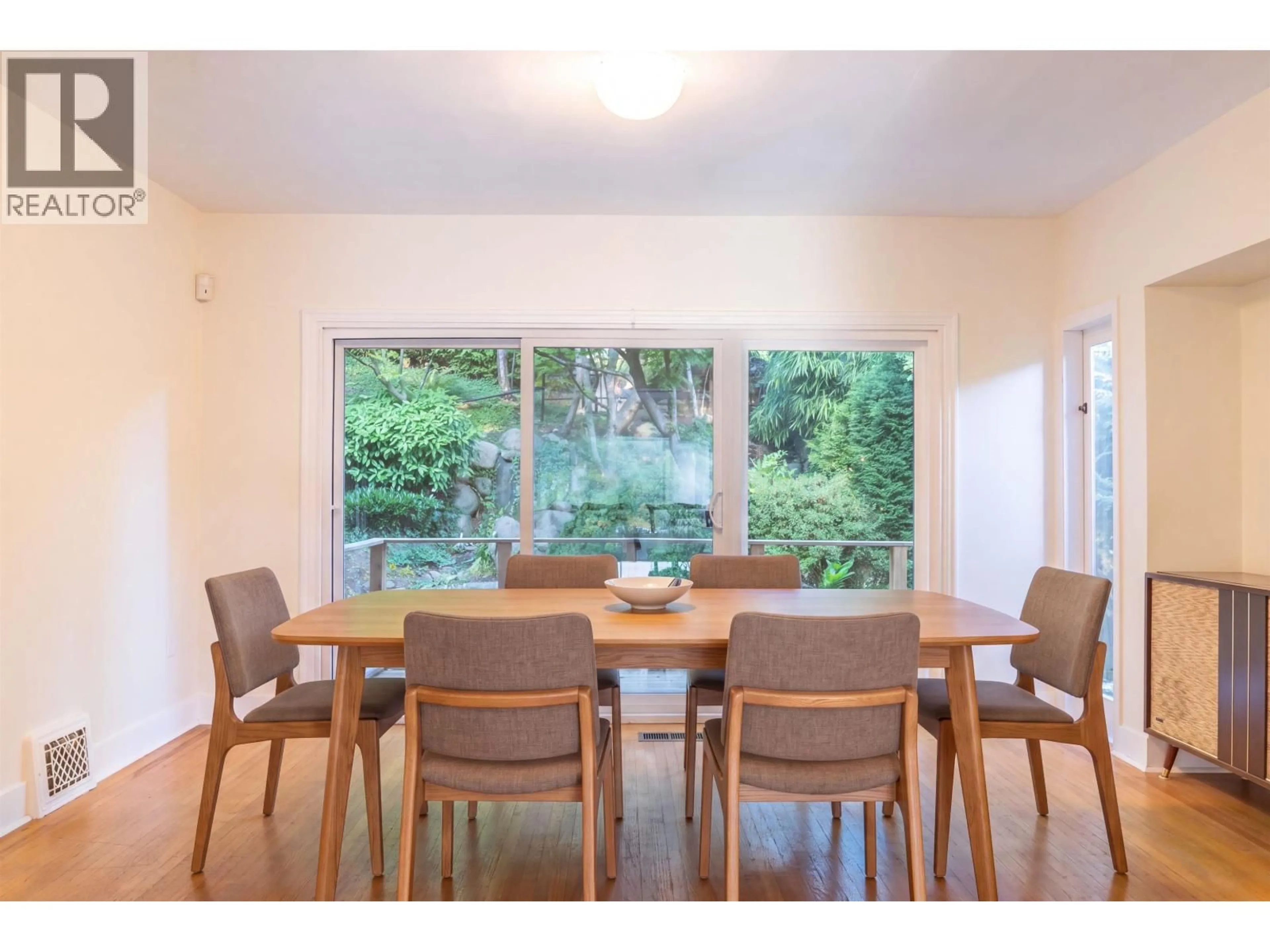 Dining room, wood/laminate floor for 4390 LOCARNO CRESCENT, Vancouver British Columbia V6R1G3