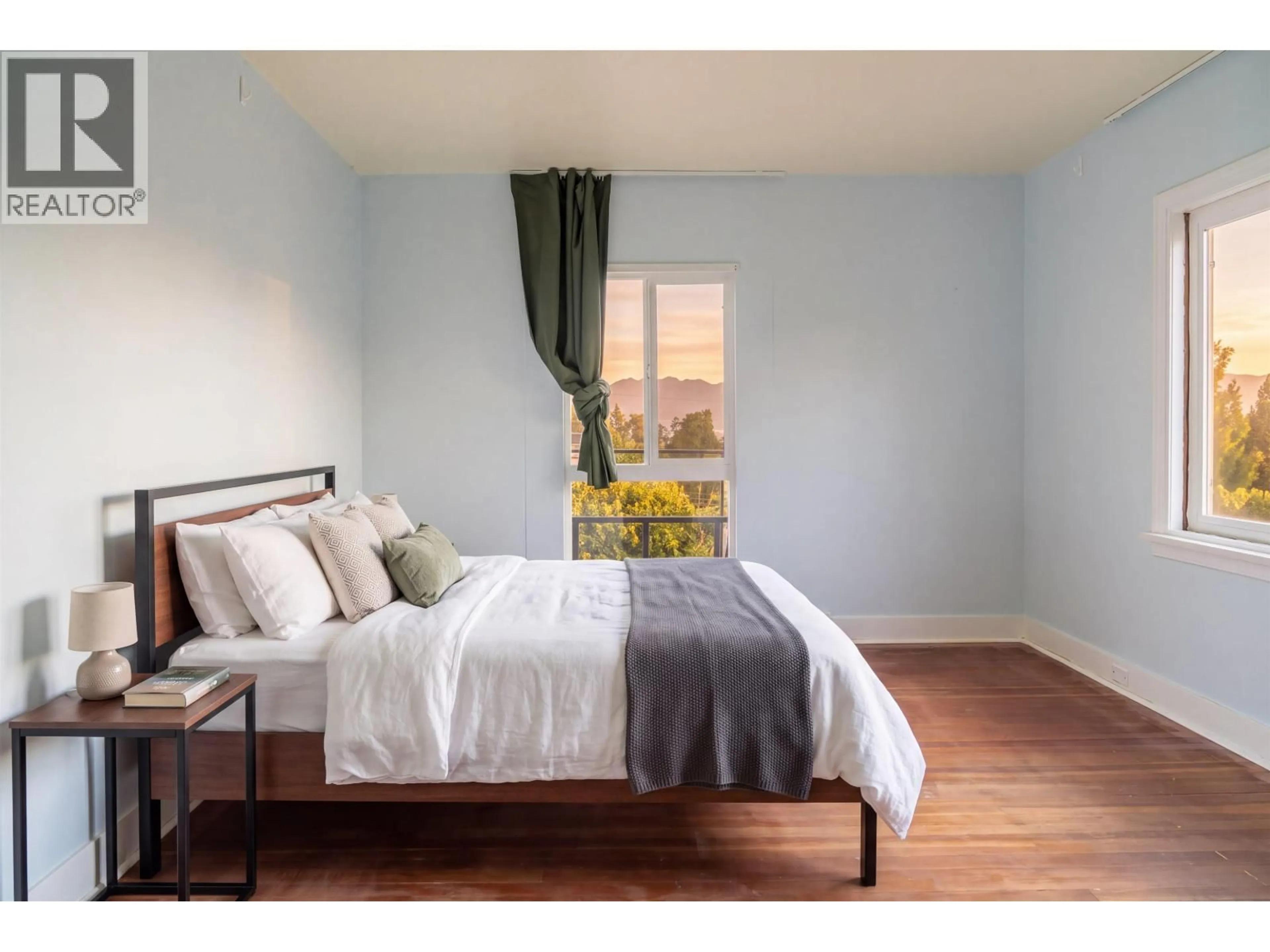 Bedroom with bed, wood/laminate floor for 4390 LOCARNO CRESCENT, Vancouver British Columbia V6R1G3