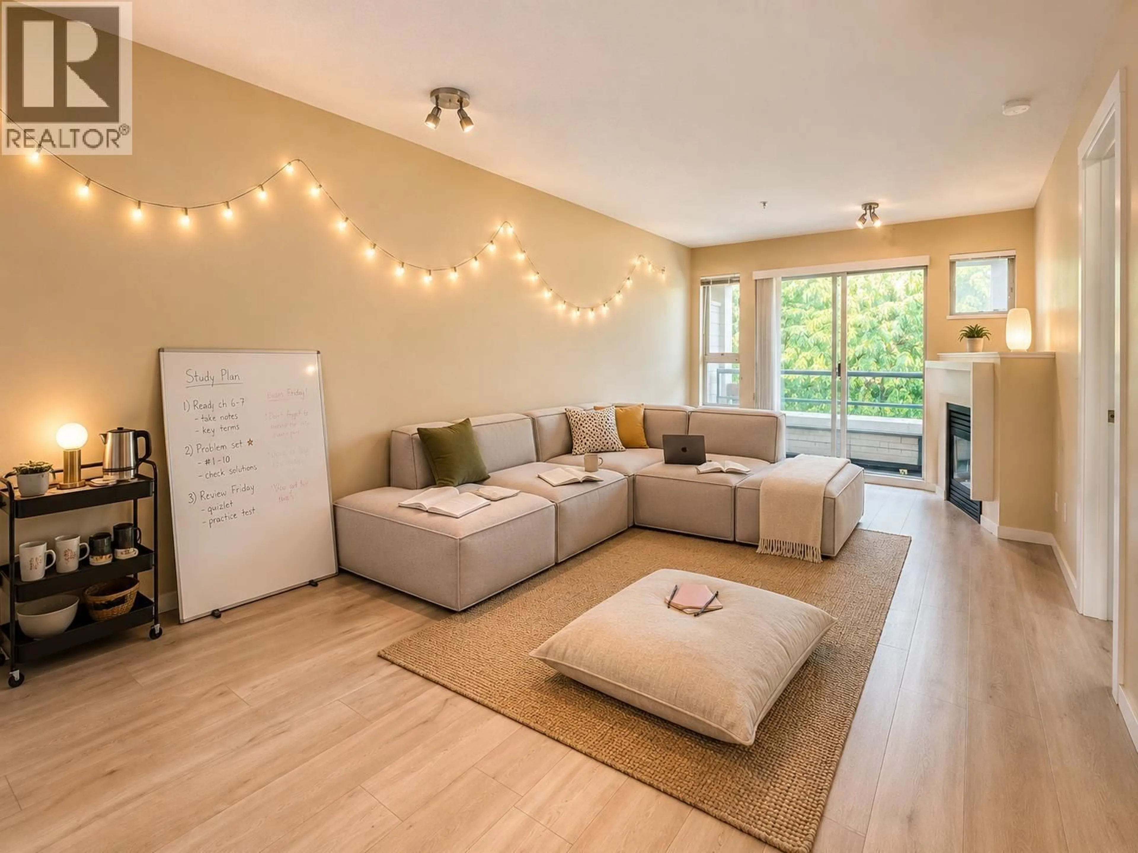 Living room with furniture, wood/laminate floor for 408 - 9319 UNIVERSITY CRESCENT, Burnaby British Columbia V5A4Y5