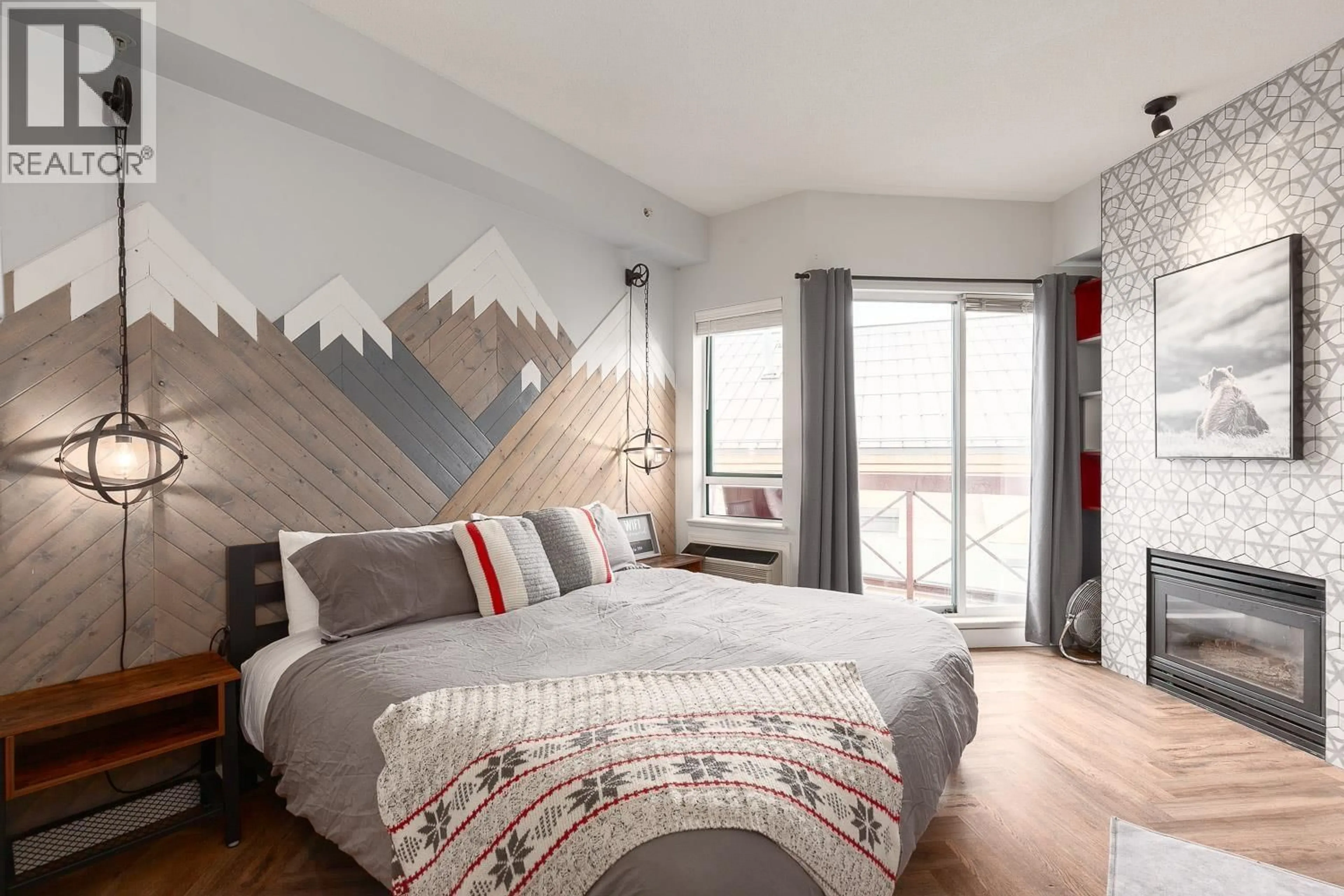 Bedroom with bed, wood/laminate floor for 318 - 4368 MAIN STREET, Whistler British Columbia V8E1B6